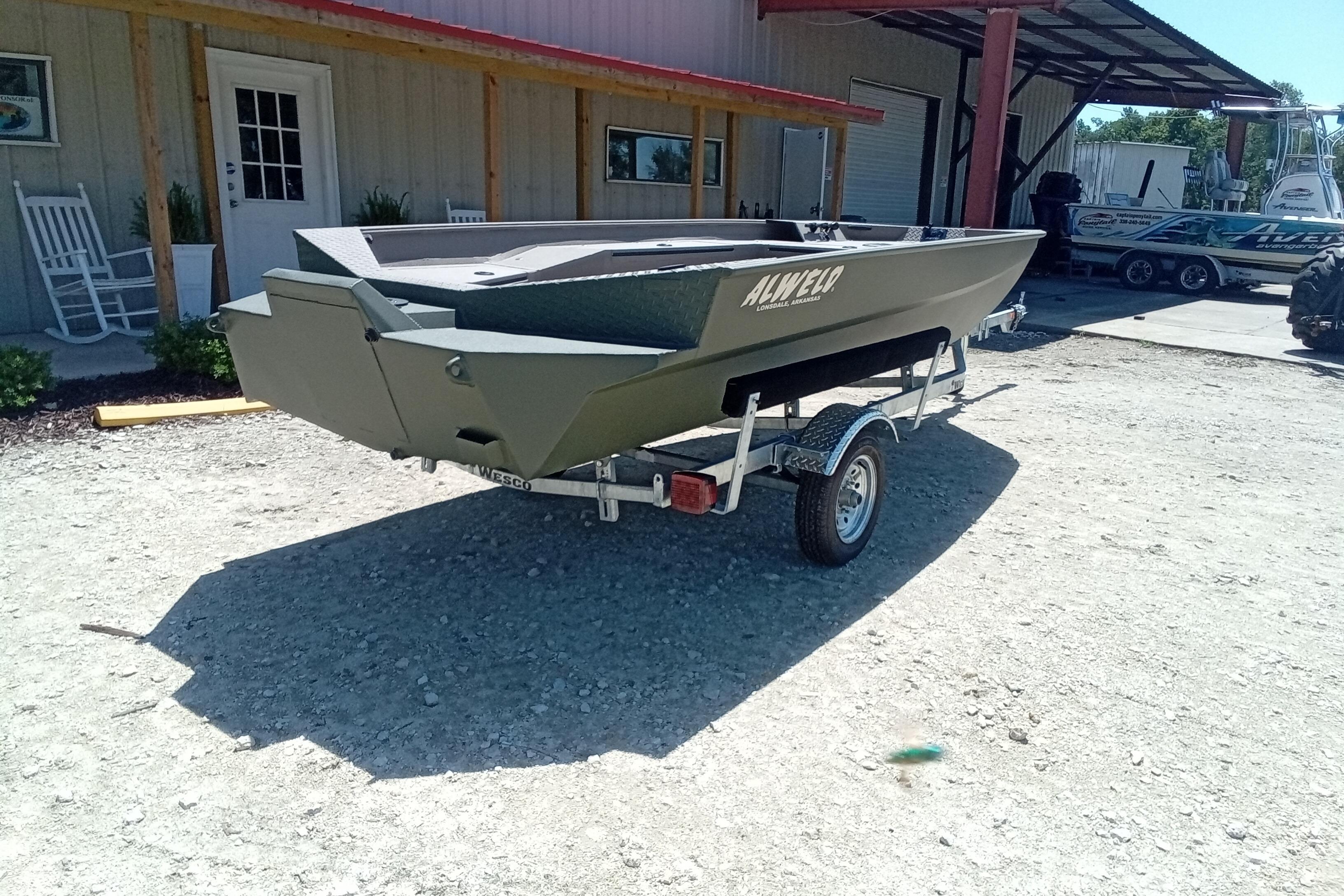 2026 Alweld 1652 Invader boat on trailer, parked outside a building.