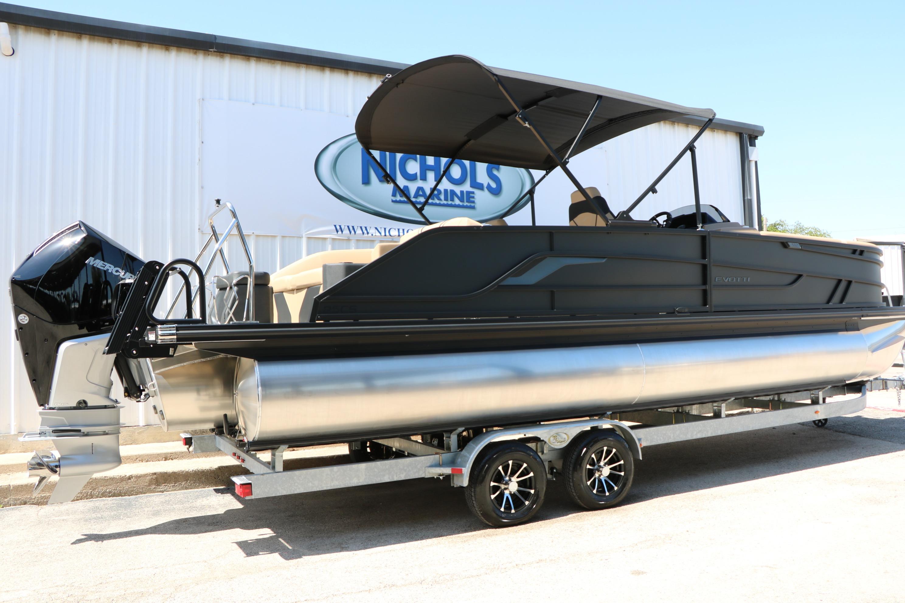2026 Evotti 725 CS Tri-Toon boat on trailer at Nichols Marine dealership.