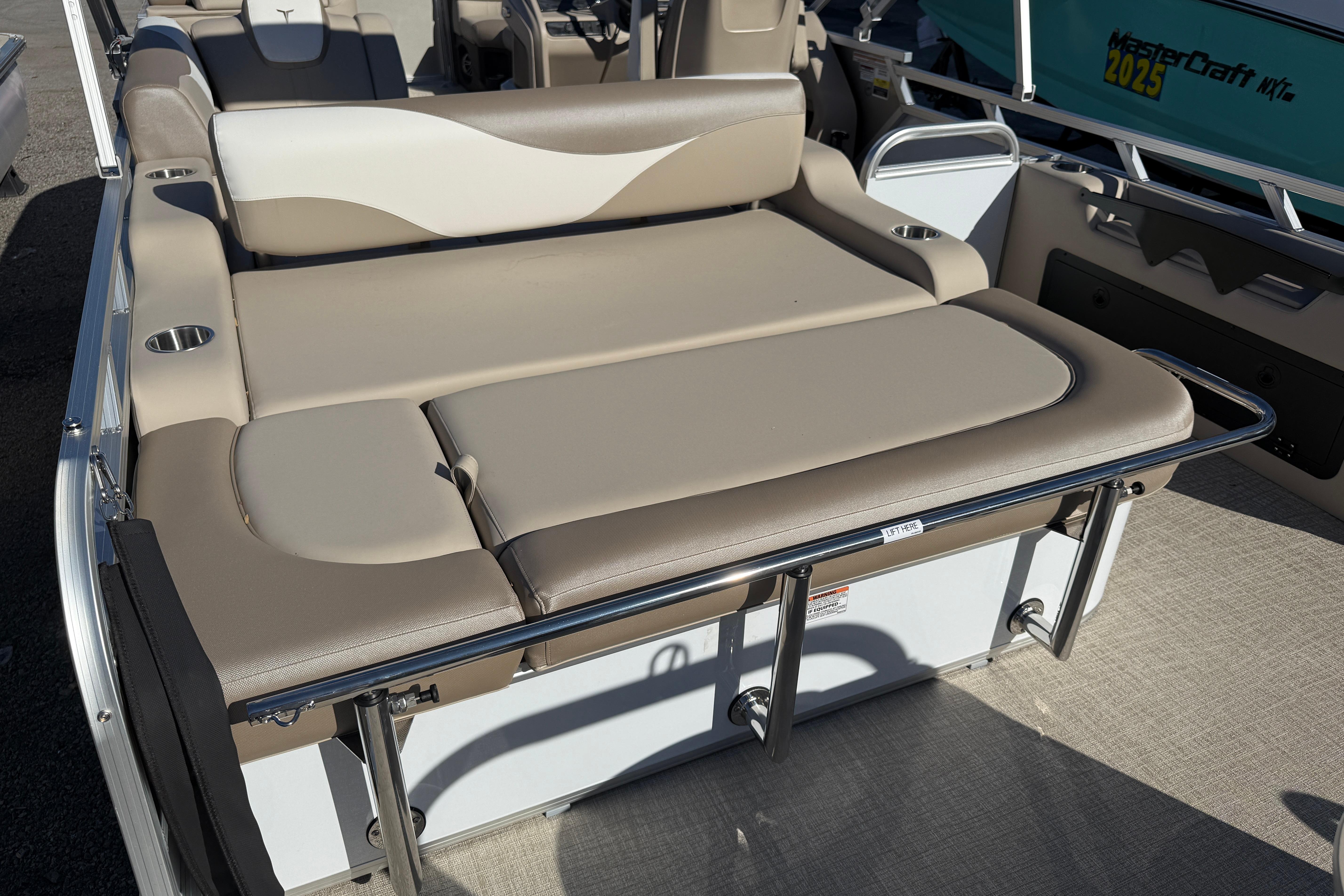 2026 Tahoe Pontoon LTZ Versatile Rear Lounger with beige seating and cup holders.