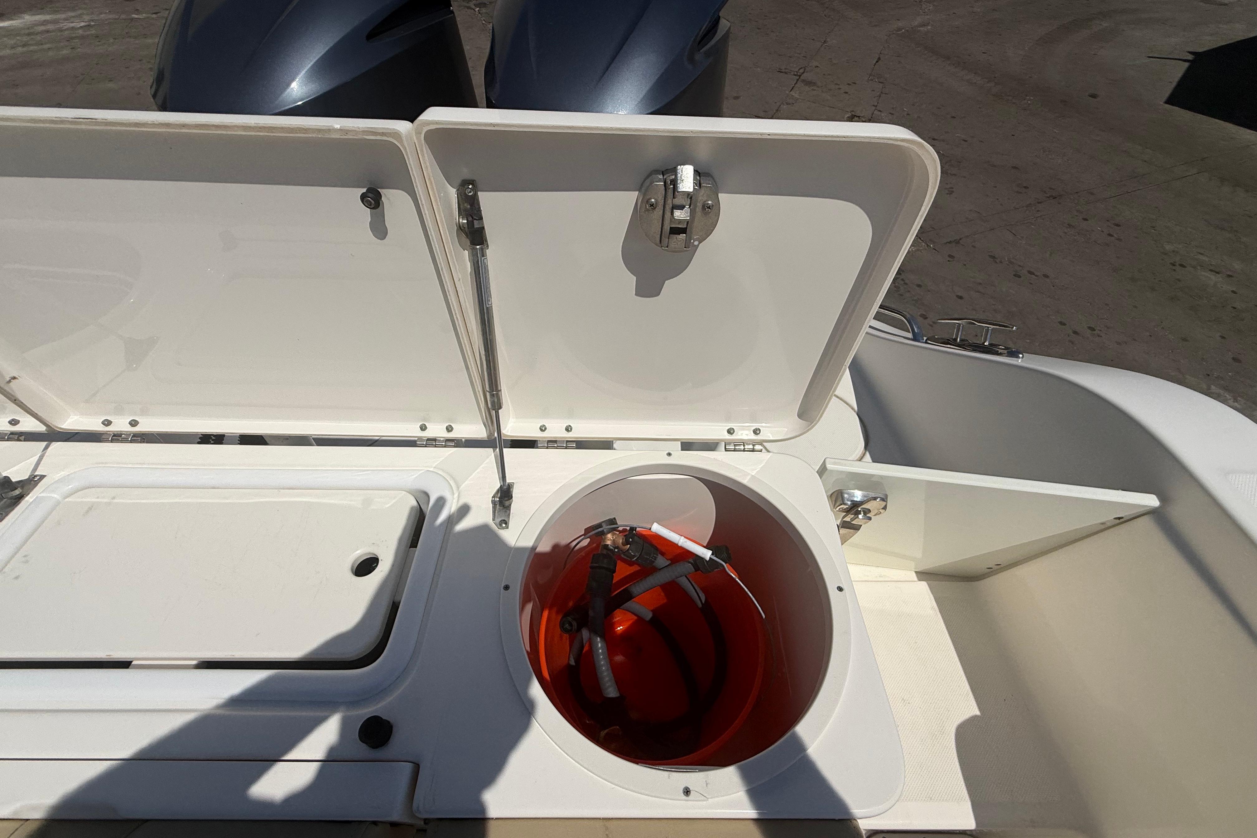 Open storage compartment on 2019 Key West Billistic 281 Center Console boat.