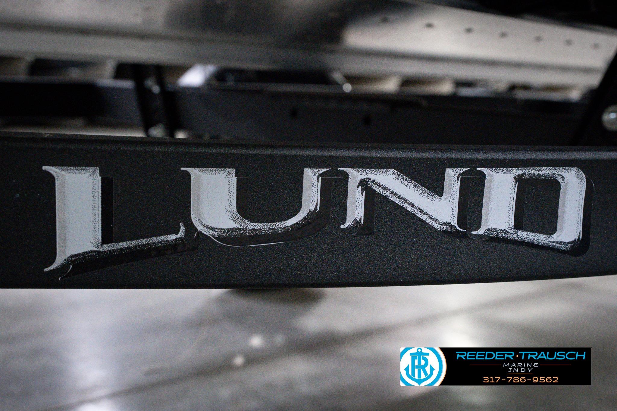 Close-up of Lund 1600 Fury SS logo on a 2026 model boat trailer.