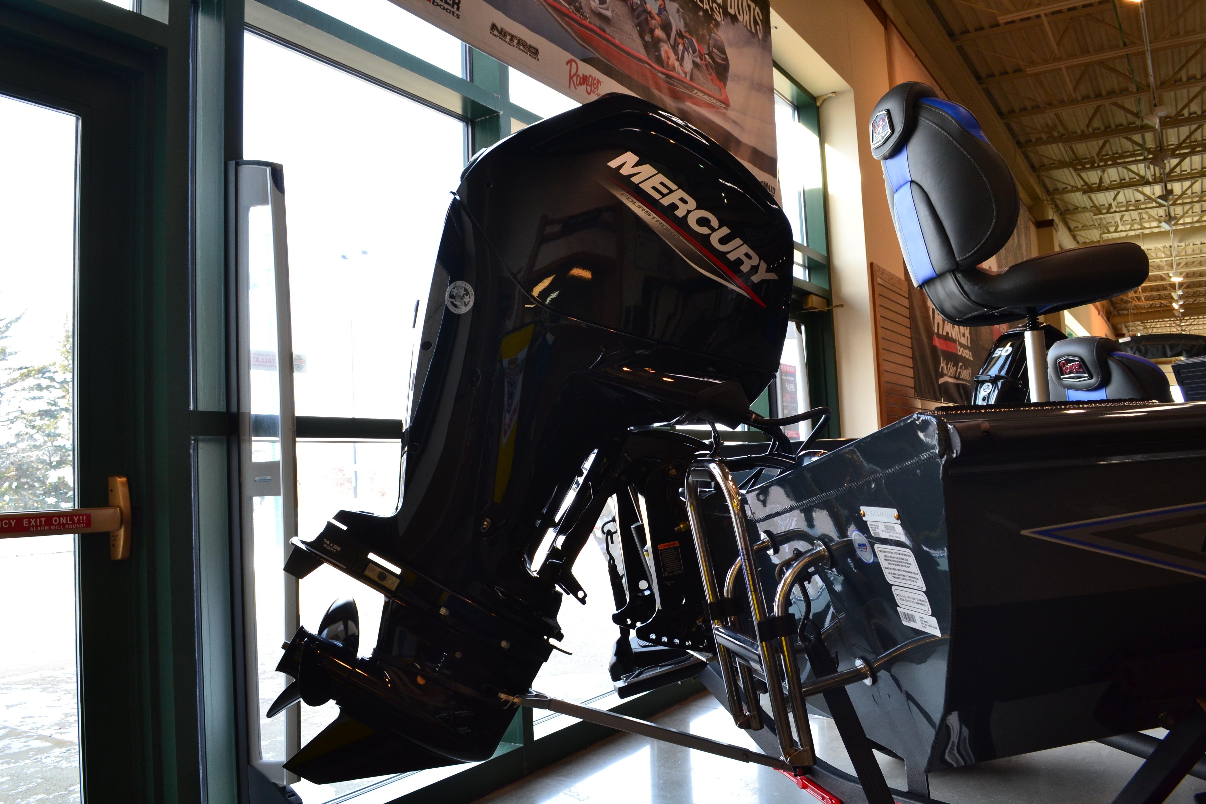 2026 Ranger RT178C boat with Mercury outboard motor displayed indoors.