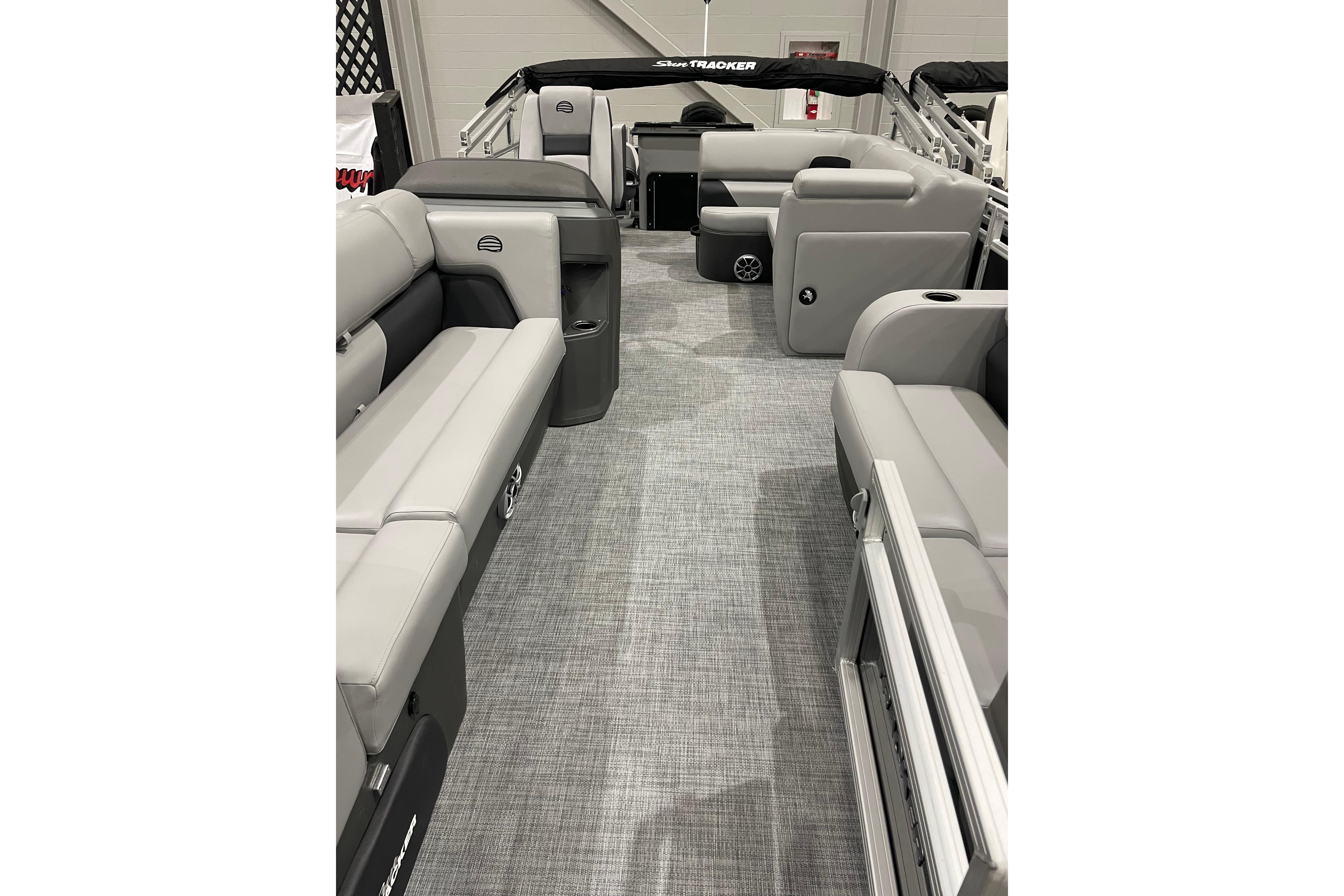 2026 Sun Tracker SportFish 22 DLX interior with gray seating and spacious layout.