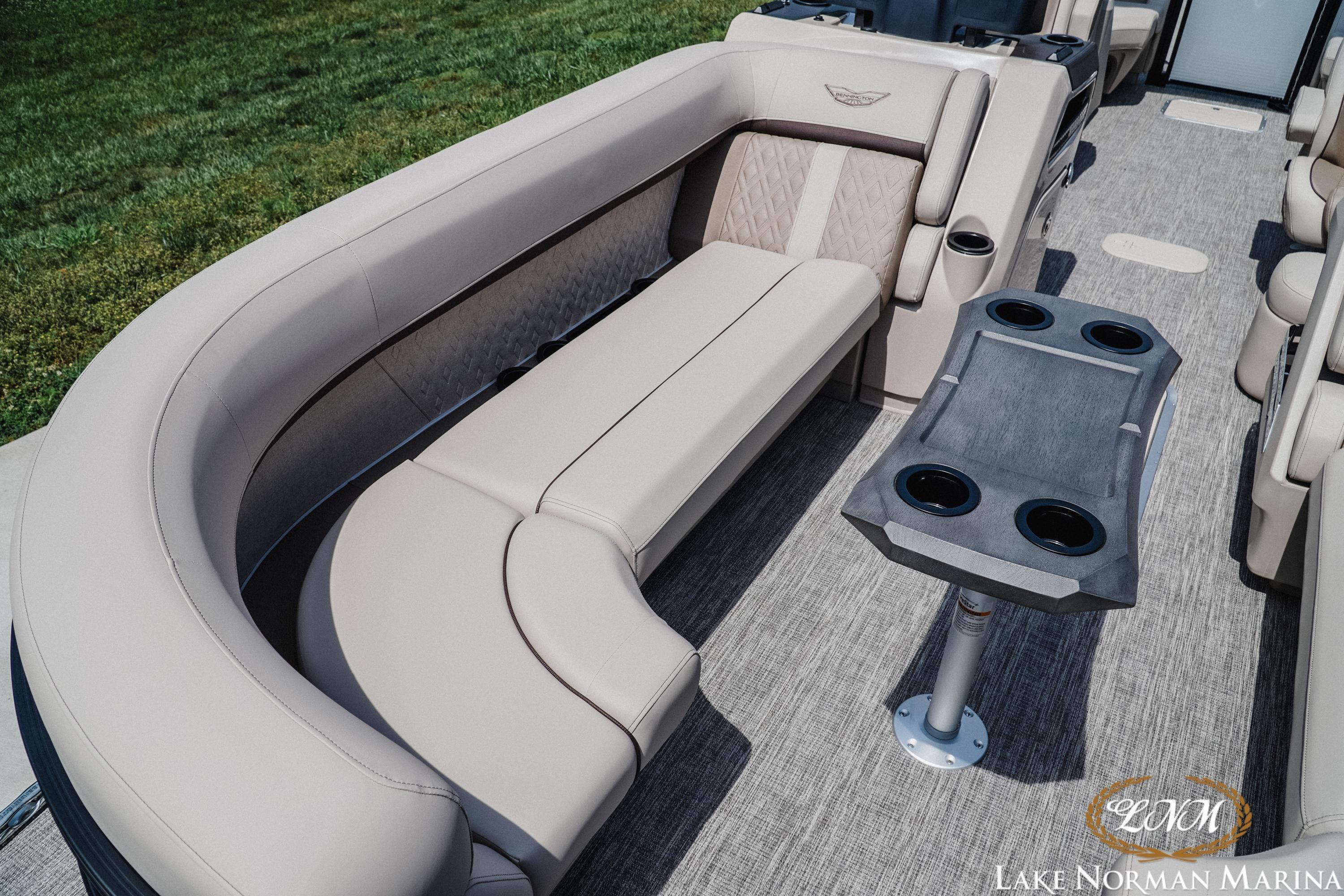 Luxurious seating on 2026 Bennington 24MFB pontoon boat with cupholders, at Lake Norman Marina.