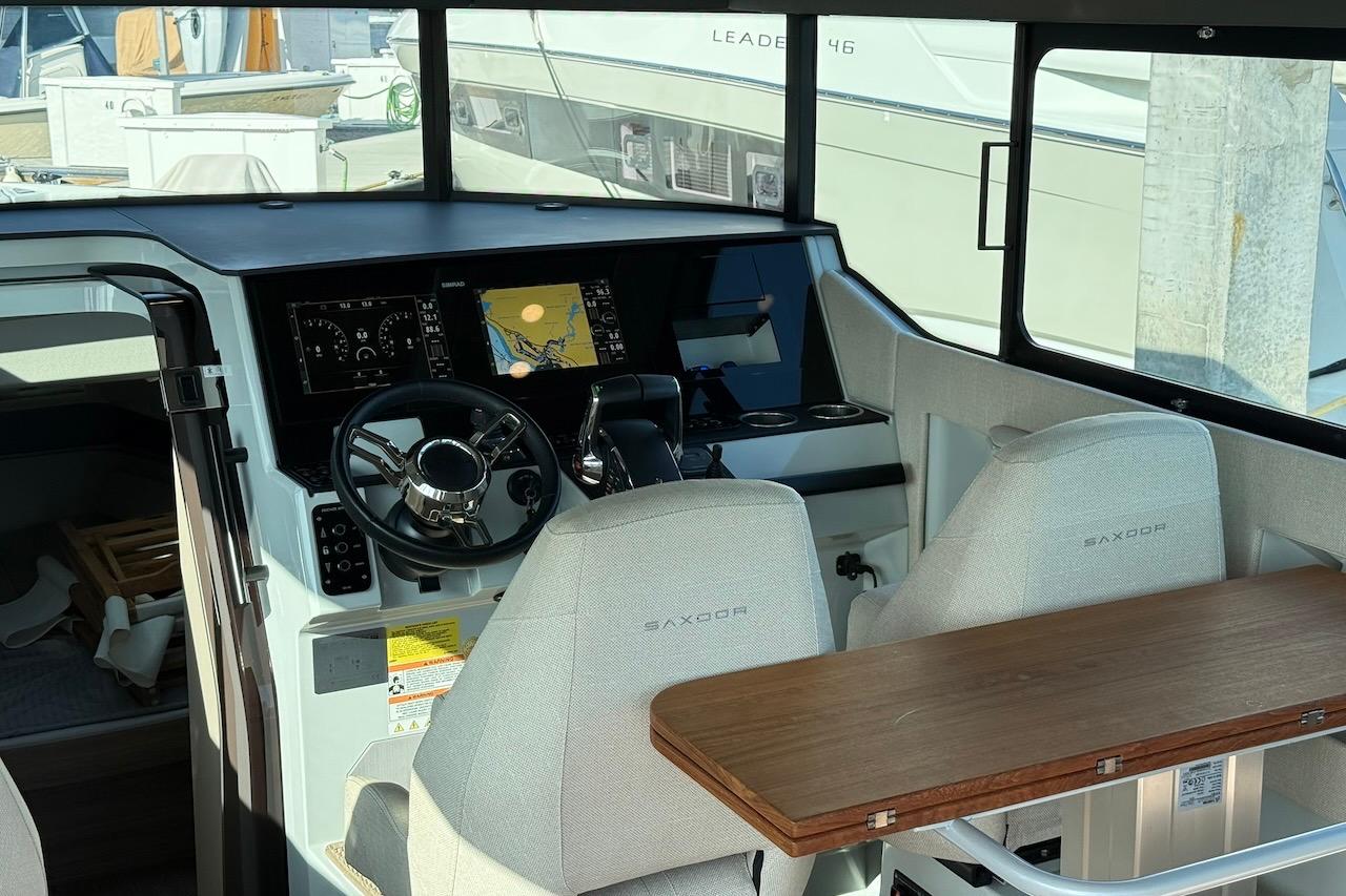 2024 Saxdor 320 GTC helm with modern navigation system and comfortable seating.