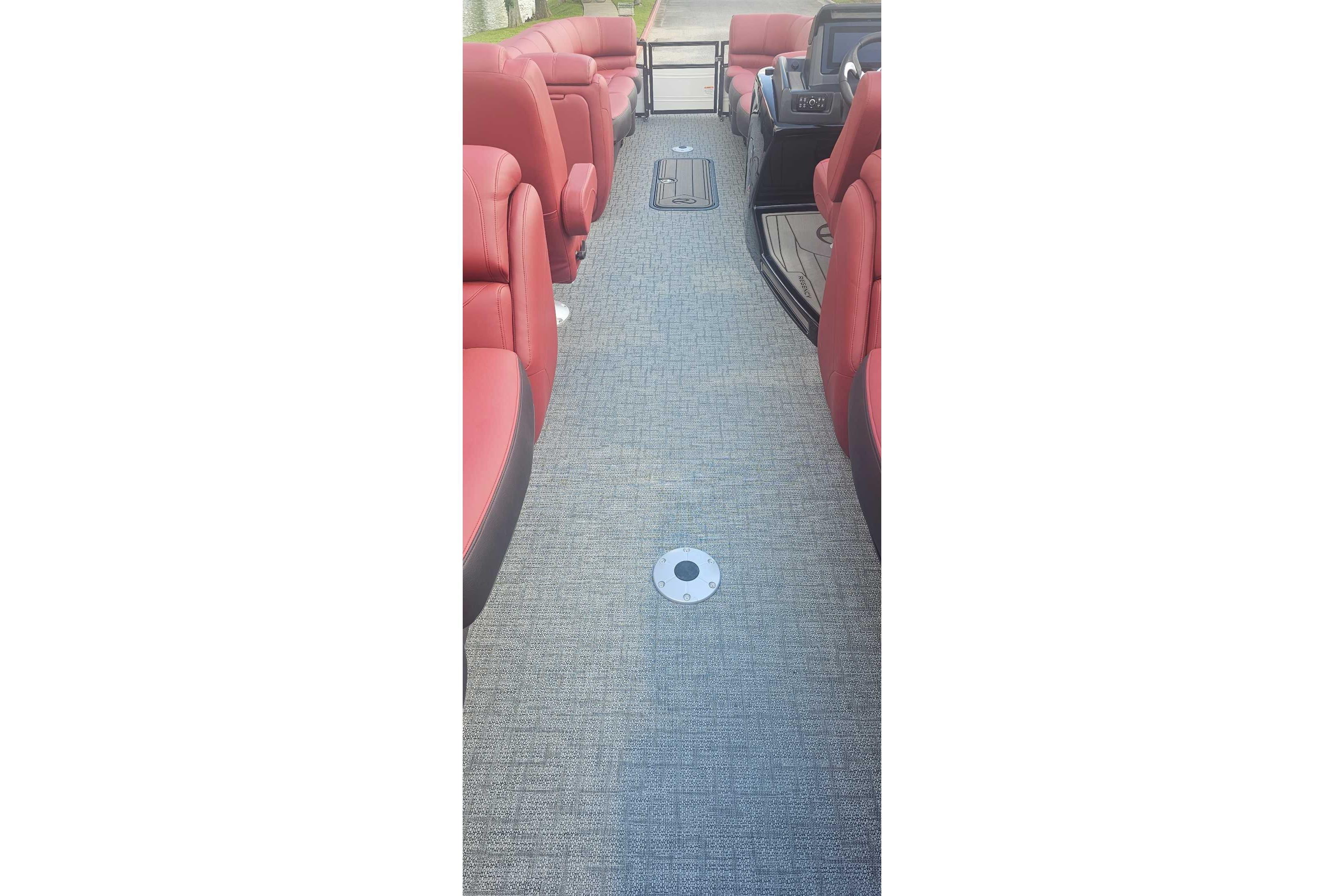 Interior view of 2026 Regency 250 DL boat with red seating and gray flooring.