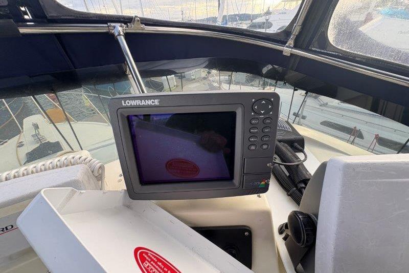 1987 Tollycraft 34 Sundeck Motor Yacht with Lowrance navigation system on deck.