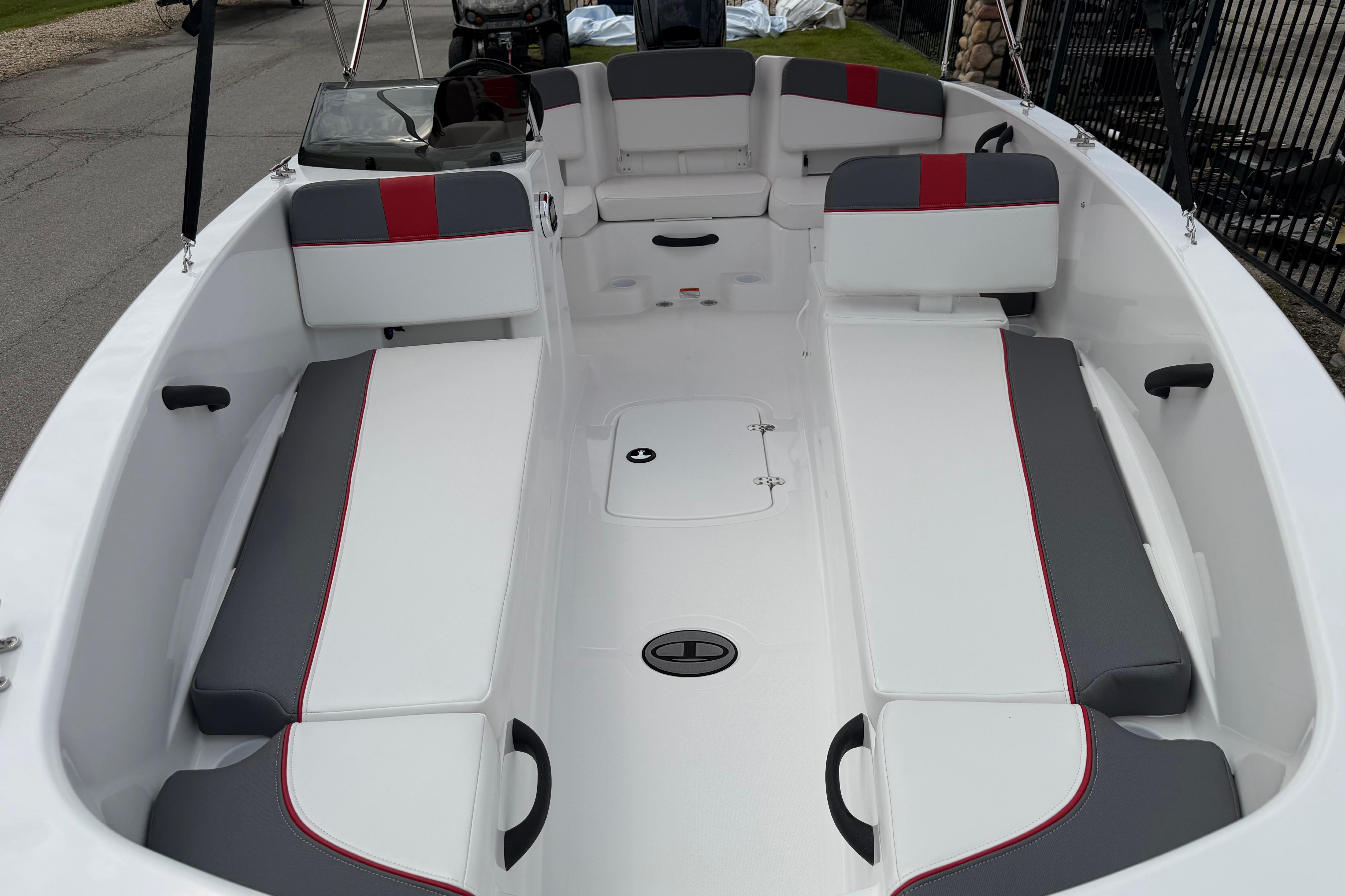 2026 Tahoe T18 boat interior with white and gray seating, red accents, and spacious layout.