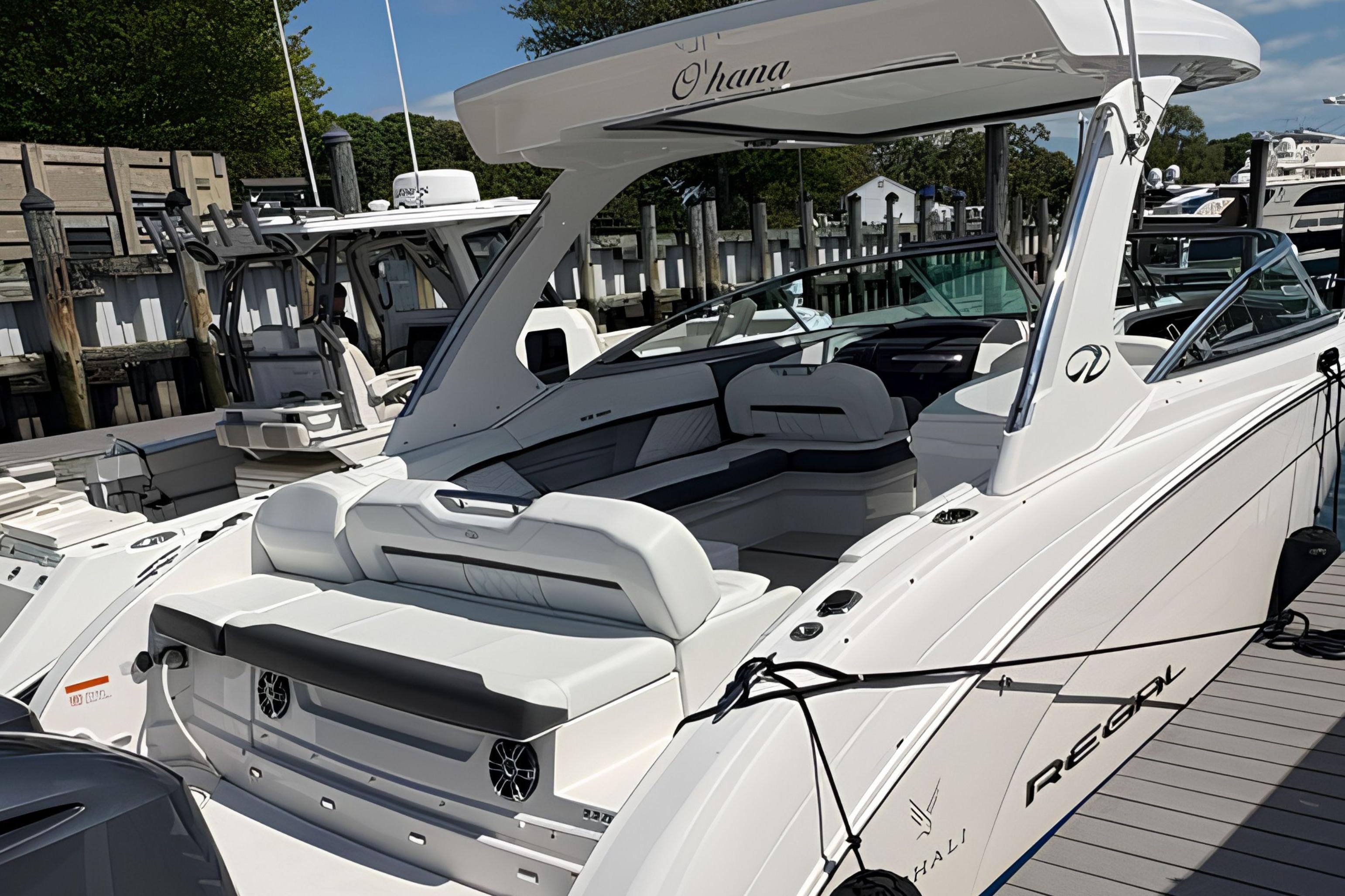 2020 Regal 33 OBX luxury boat docked, featuring sleek design and spacious seating.