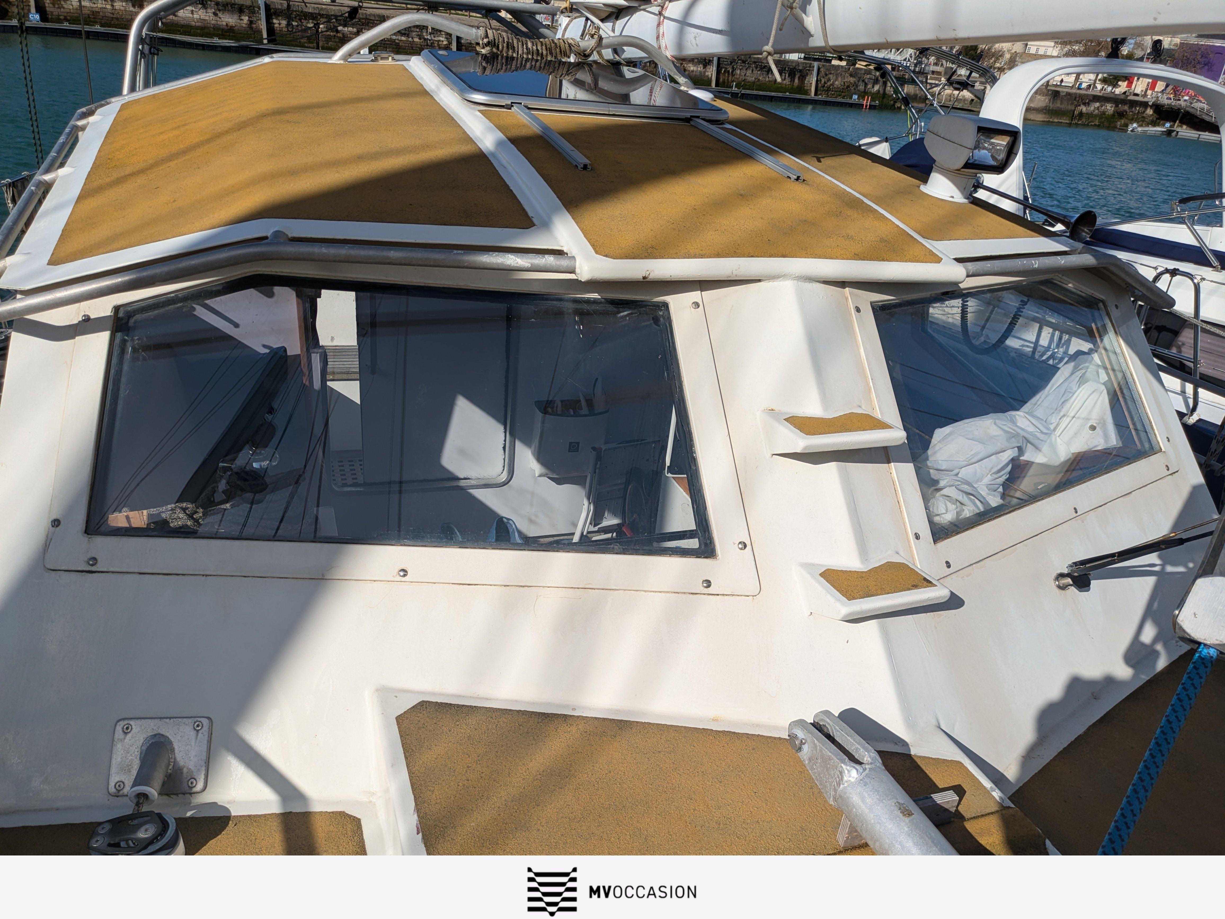 2003 Rare Chatam 60 sailboat cockpit with tan cover, docked at marina.