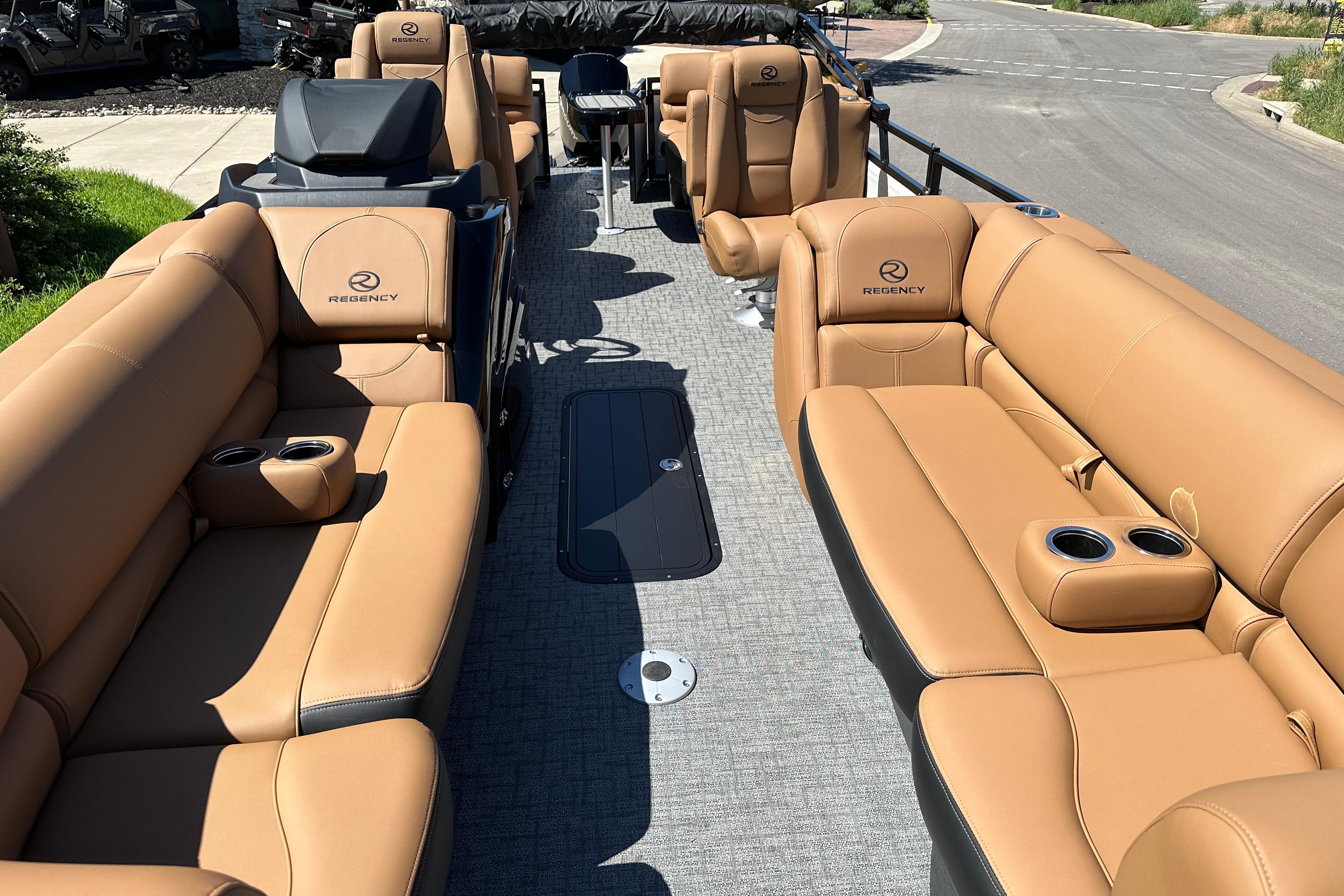 2026 Regency 230 DL pontoon boat with luxurious tan seating and modern design.