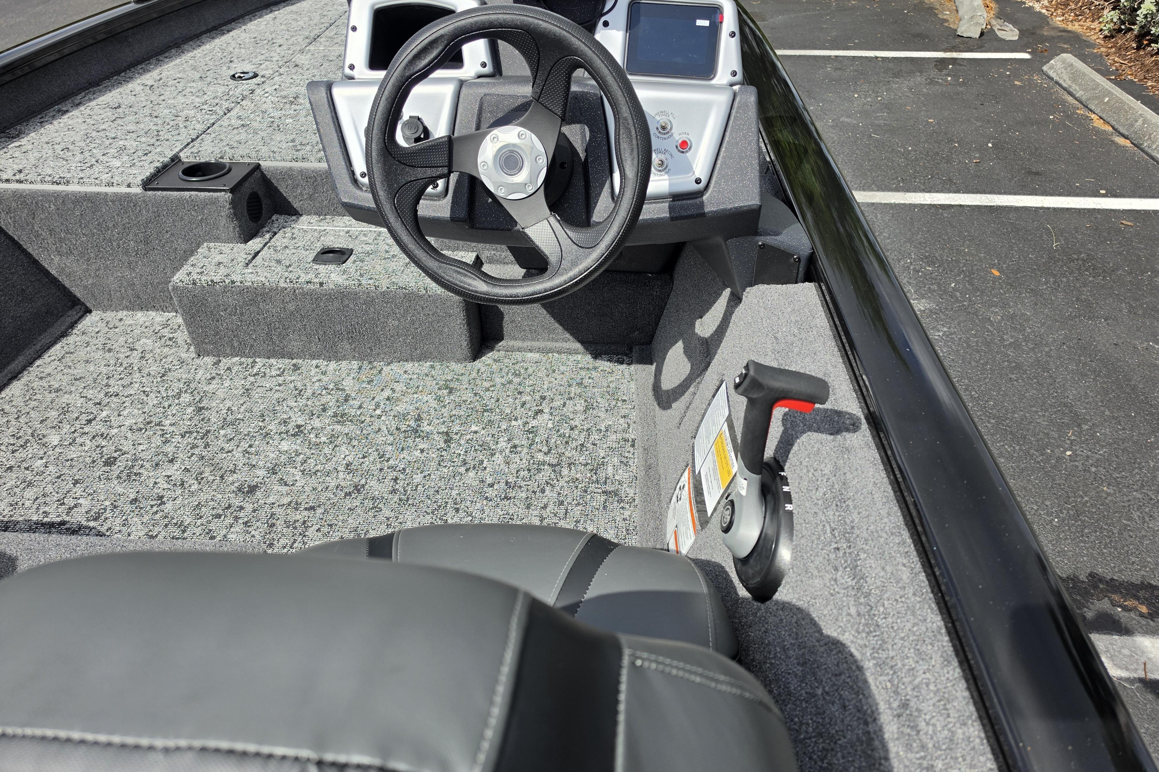 2026 Tracker Pro Team 190 boat interior with steering wheel and controls.