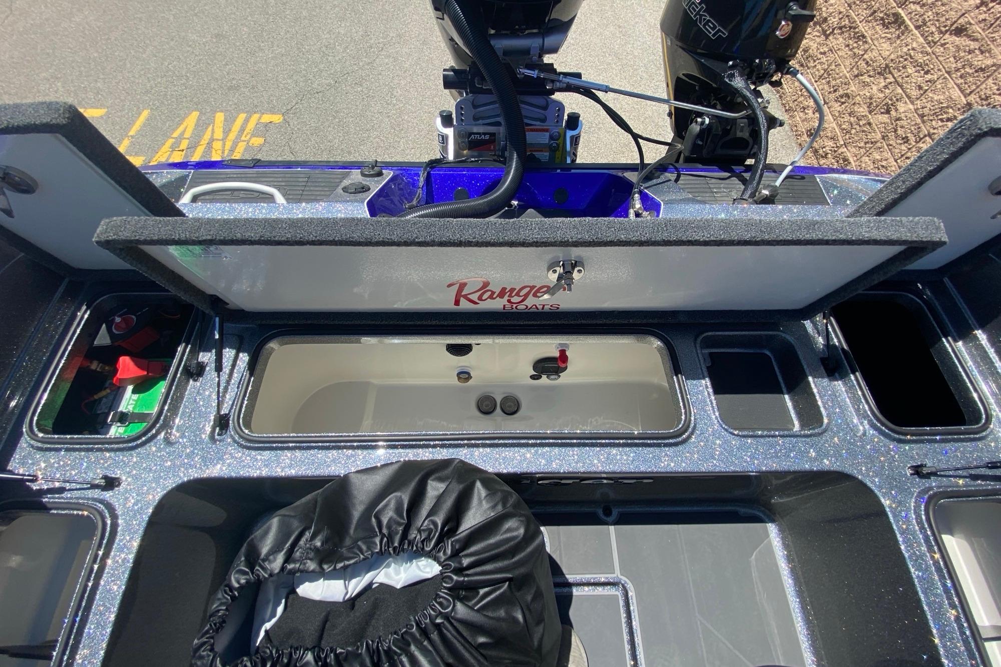 2026 Ranger 622FS Pro boat interior with storage compartments and motor, showcasing functionality and design.