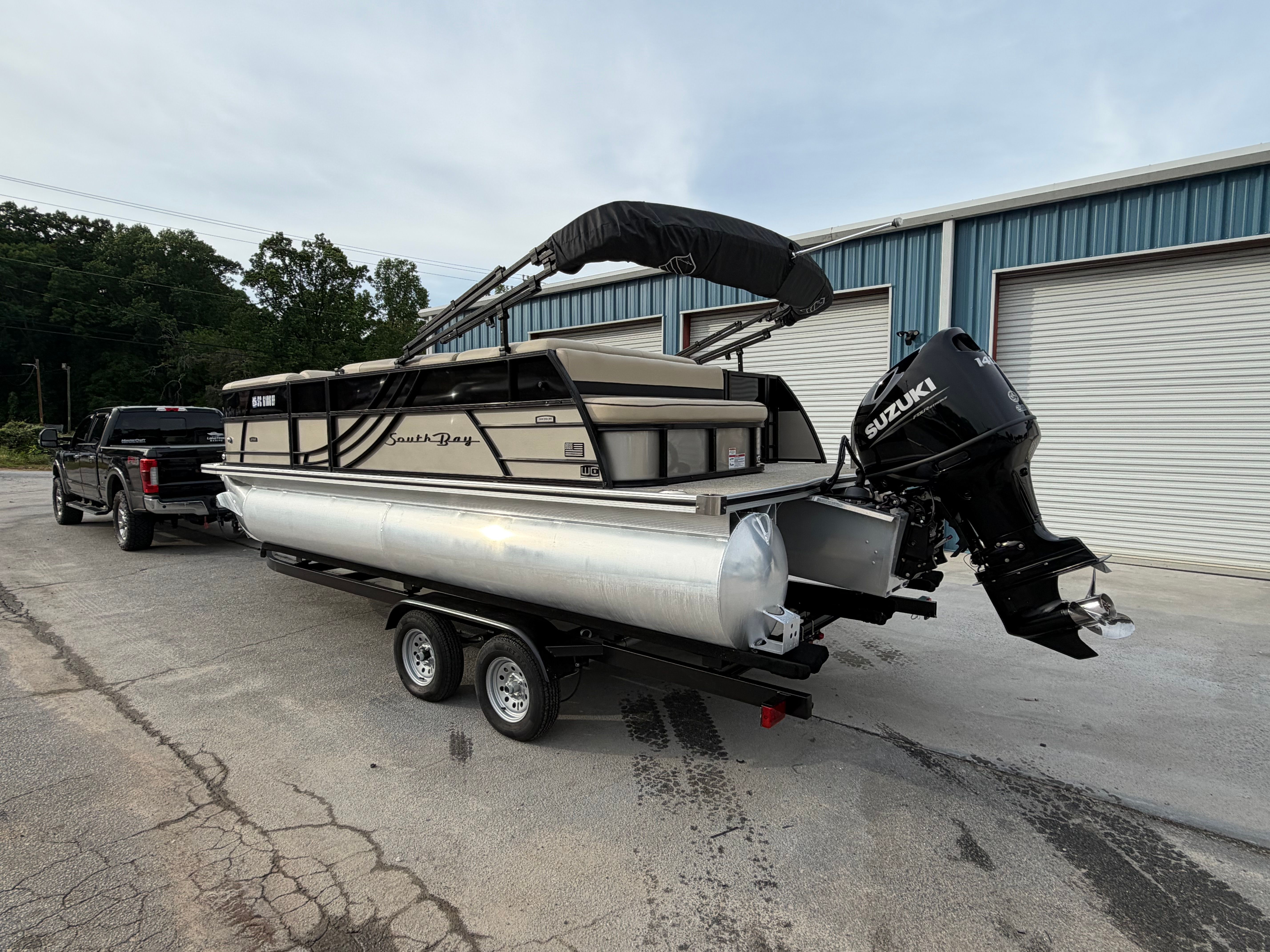 2023 South Bay S222 CR2 pontoon boat on trailer.