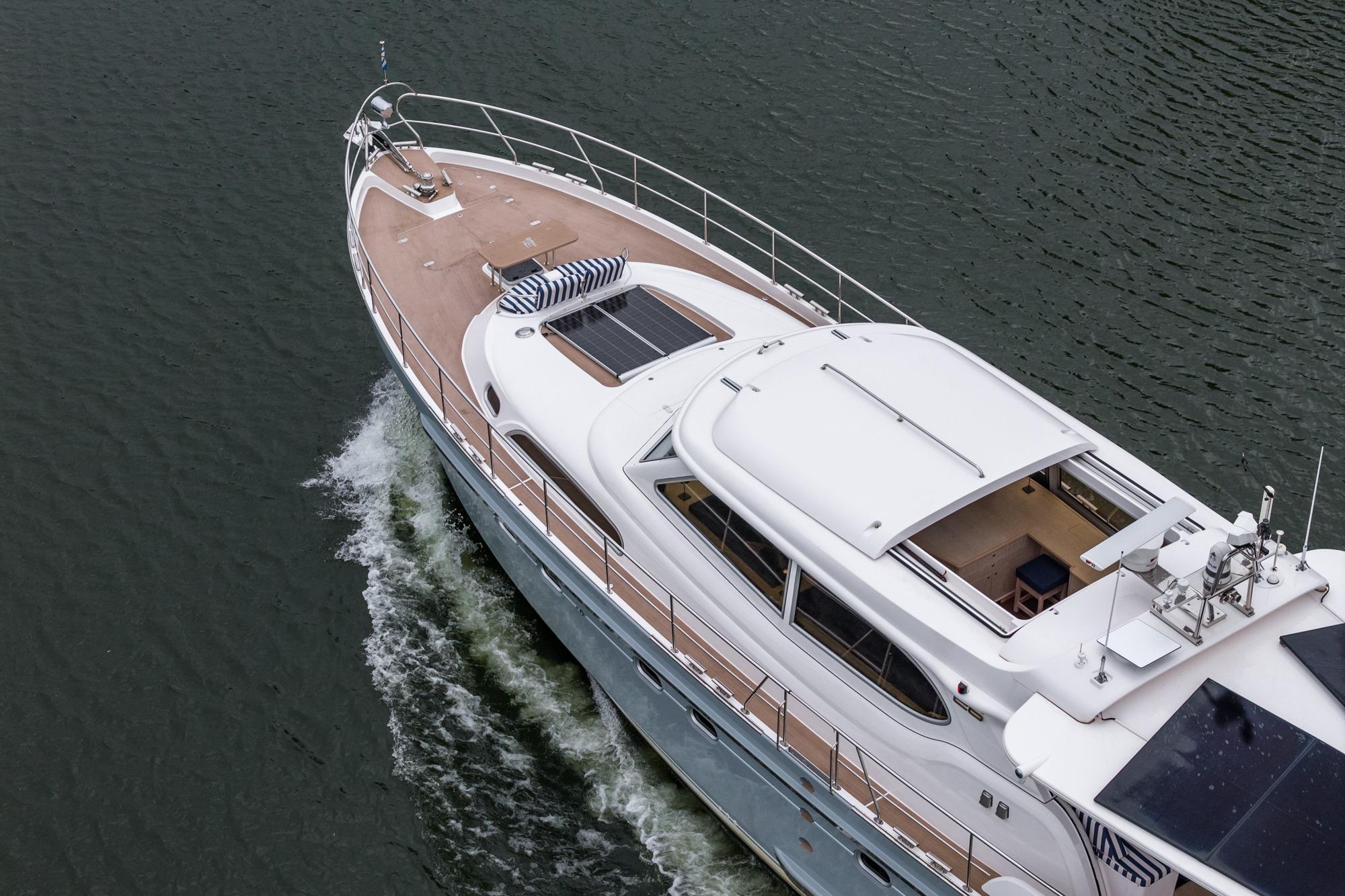 Luxurious 2025 Elling E6 yacht cruising on calm waters, showcasing sleek design and spacious deck.