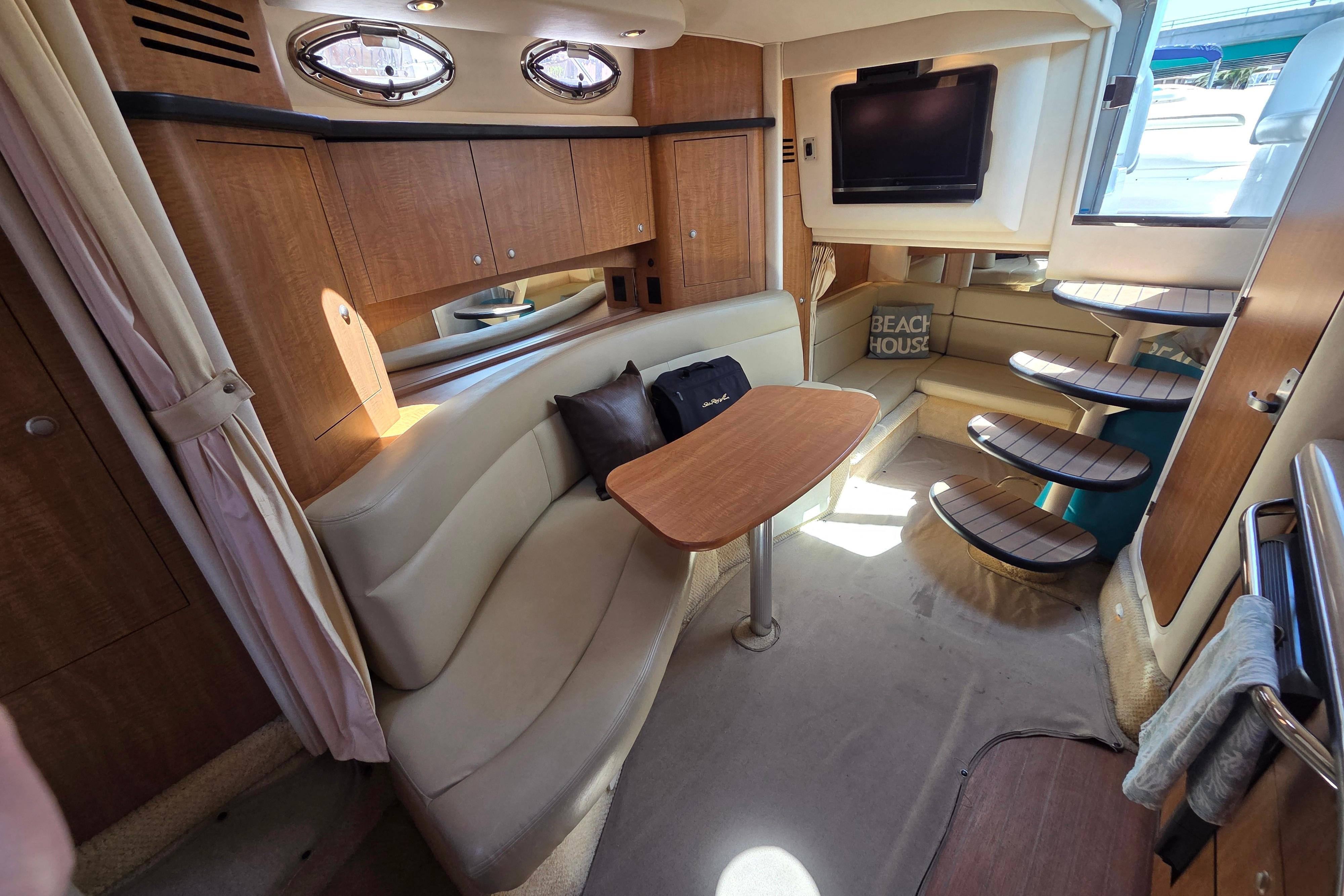 Interior of 2006 Sea Ray Sundancer 320 yacht with cozy seating and modern amenities.