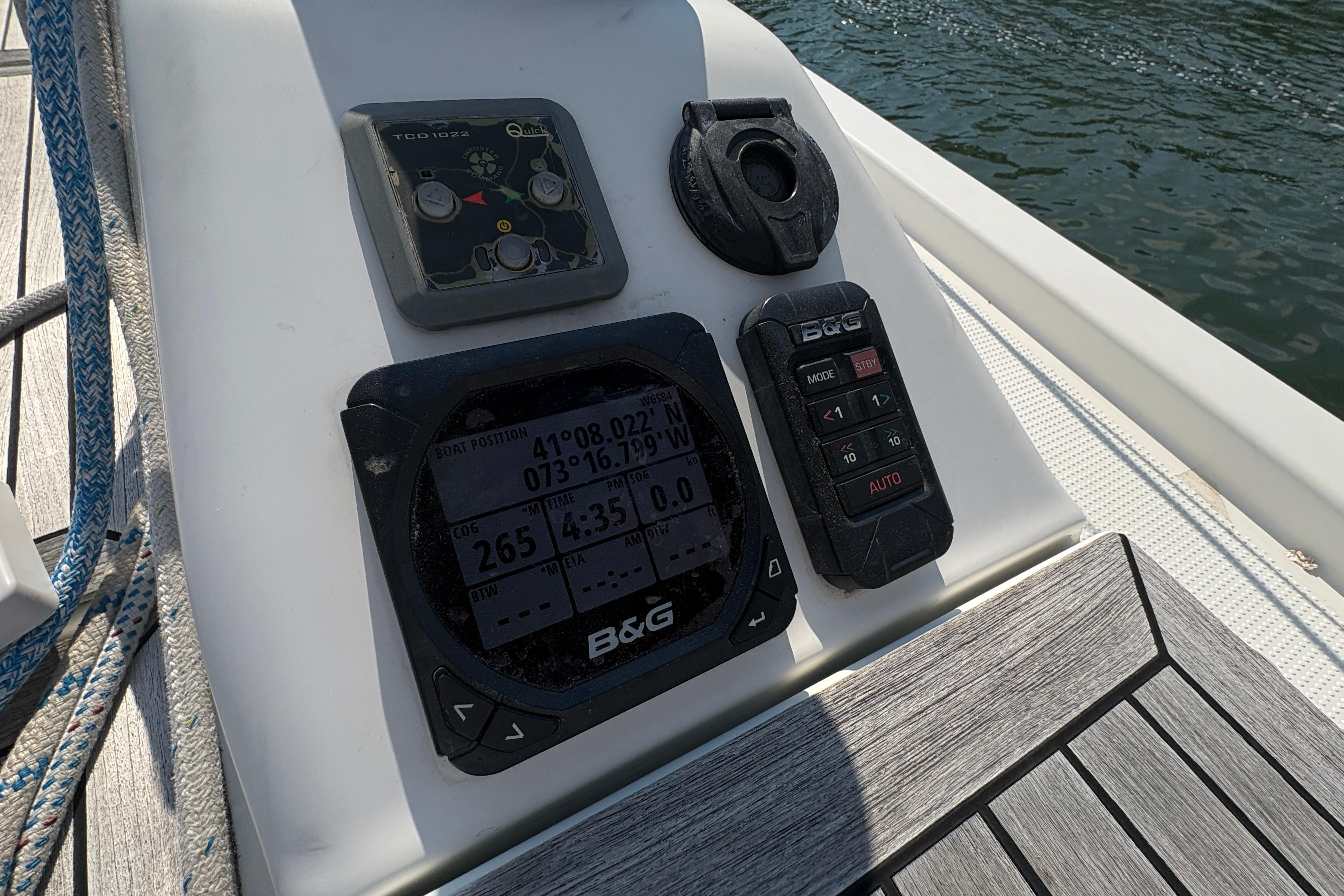 Navigation instruments on a 2014 Hanse 415 yacht, displaying coordinates and settings.