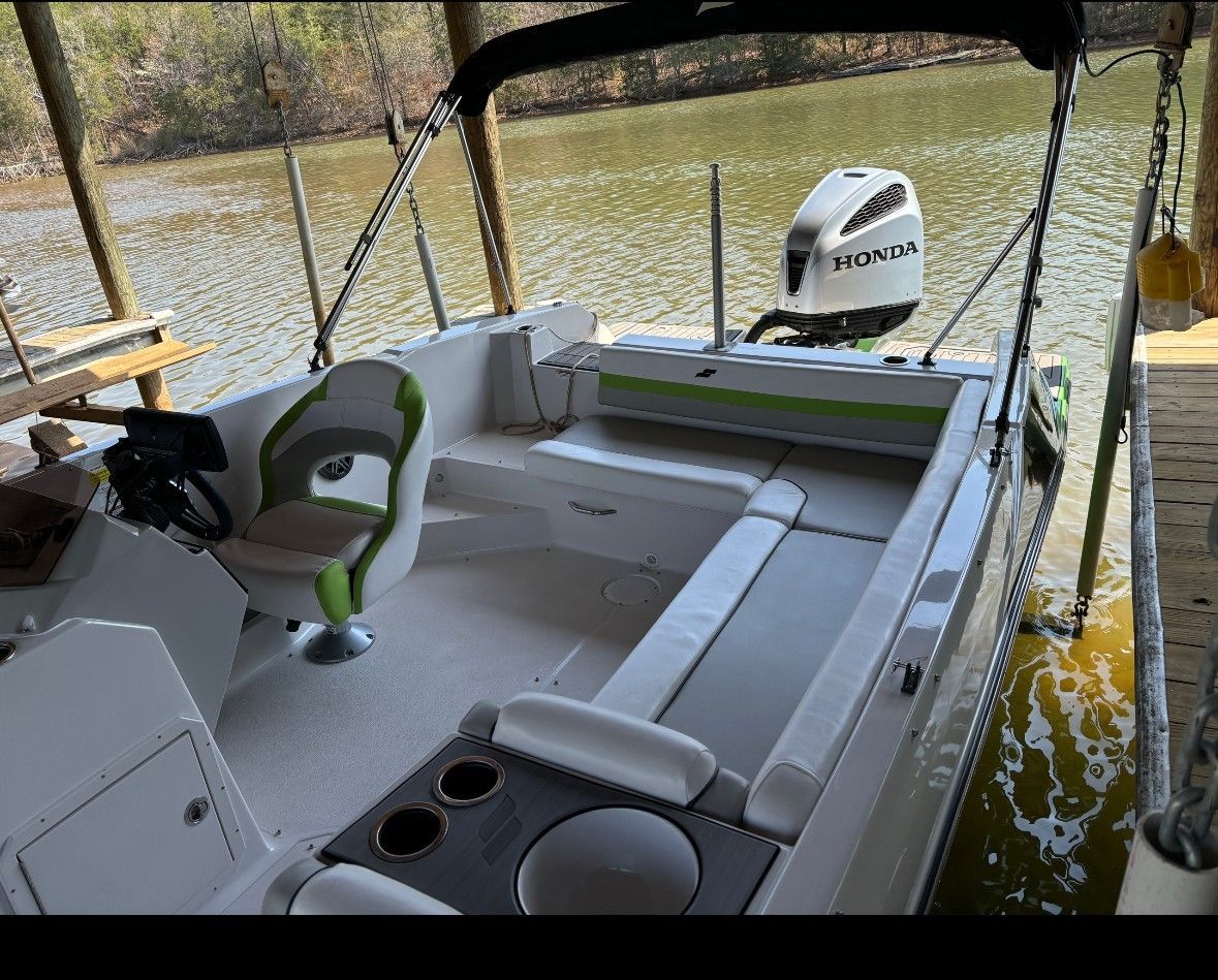Interior of a 2023 Starcraft SVX 211 boat with Honda engine.