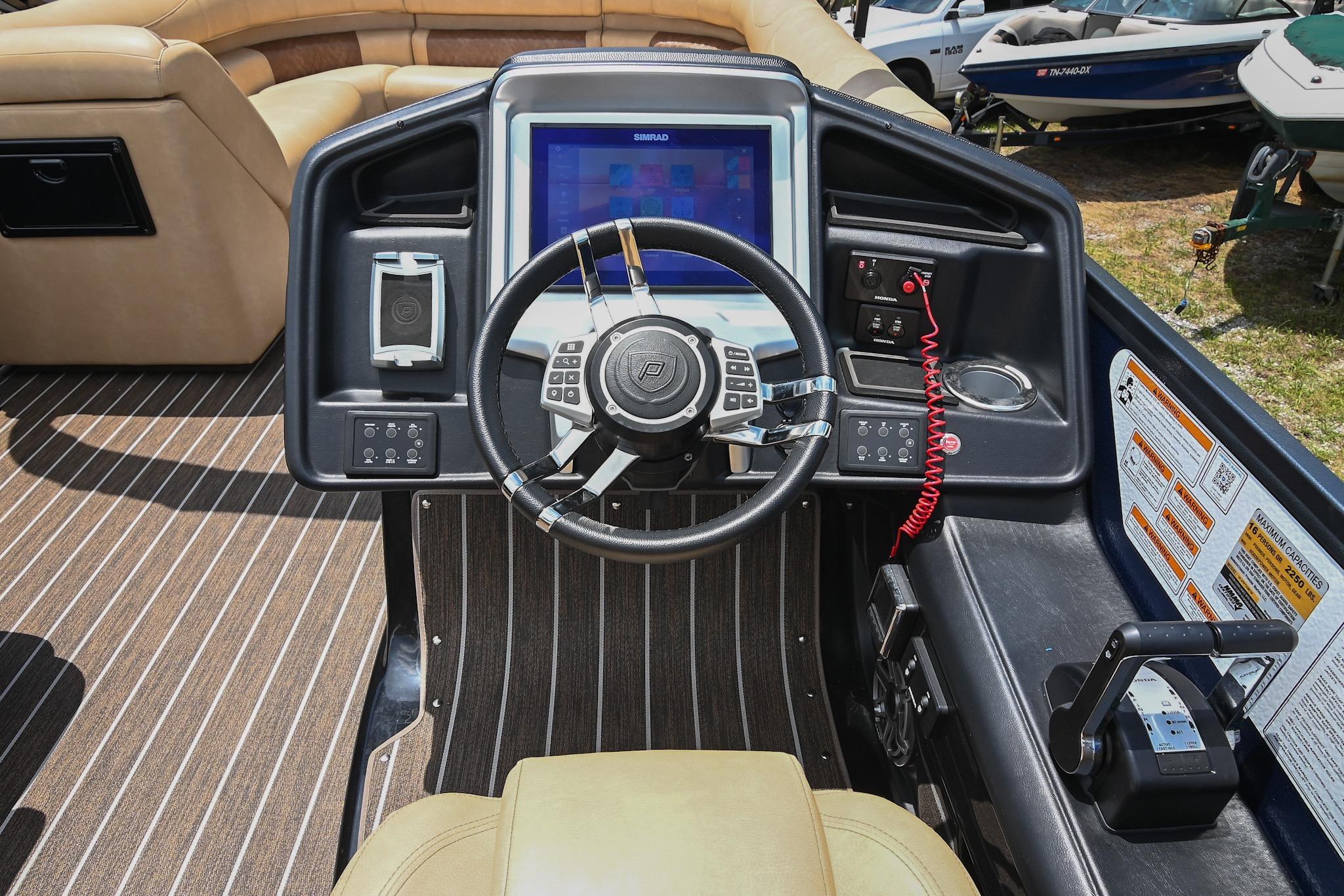 Cockpit of 2023 Premier 270 Intrigue RF boat with modern steering and controls.