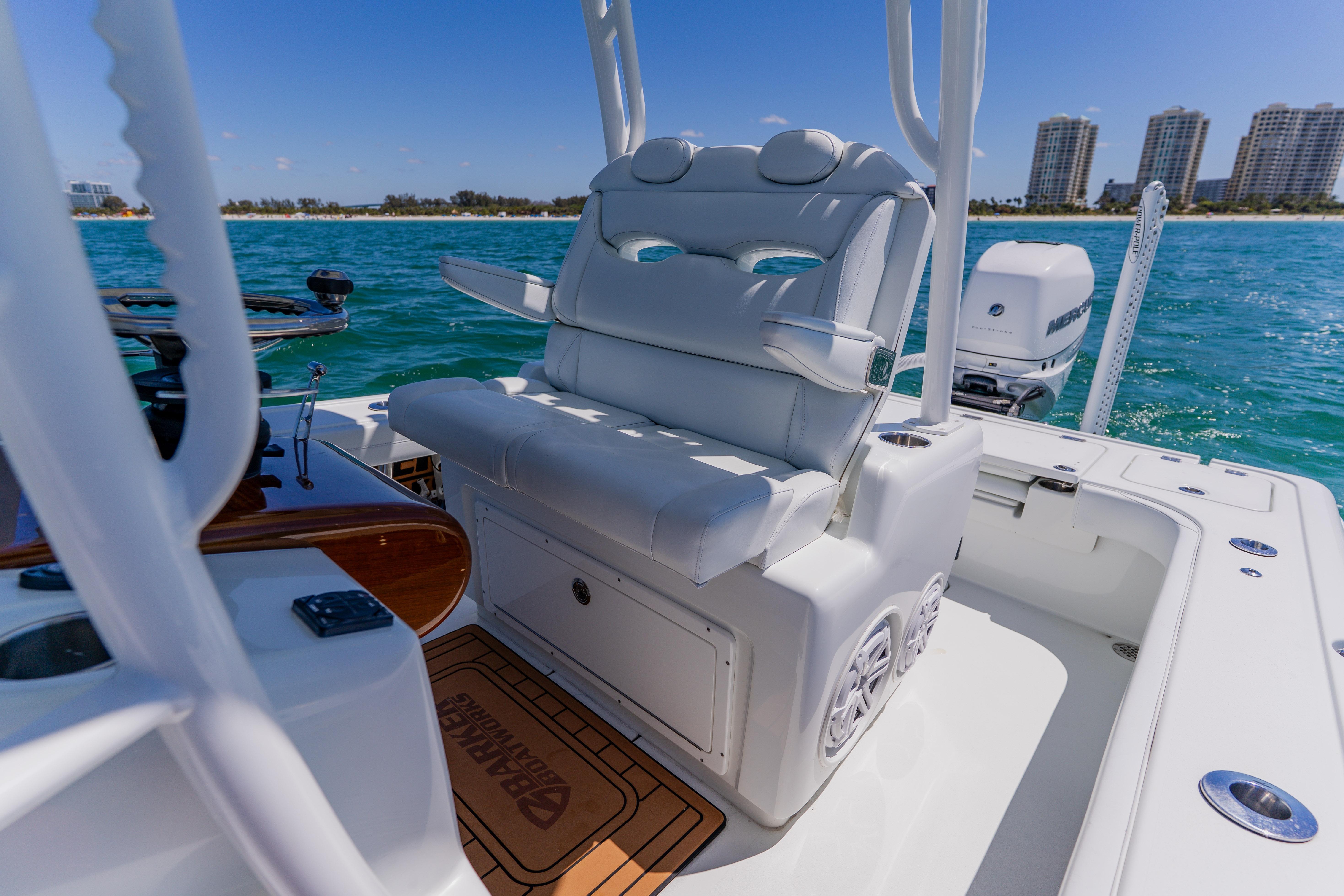 2017 Barker Boatworks 26 with luxurious seating on a sunny day at sea.