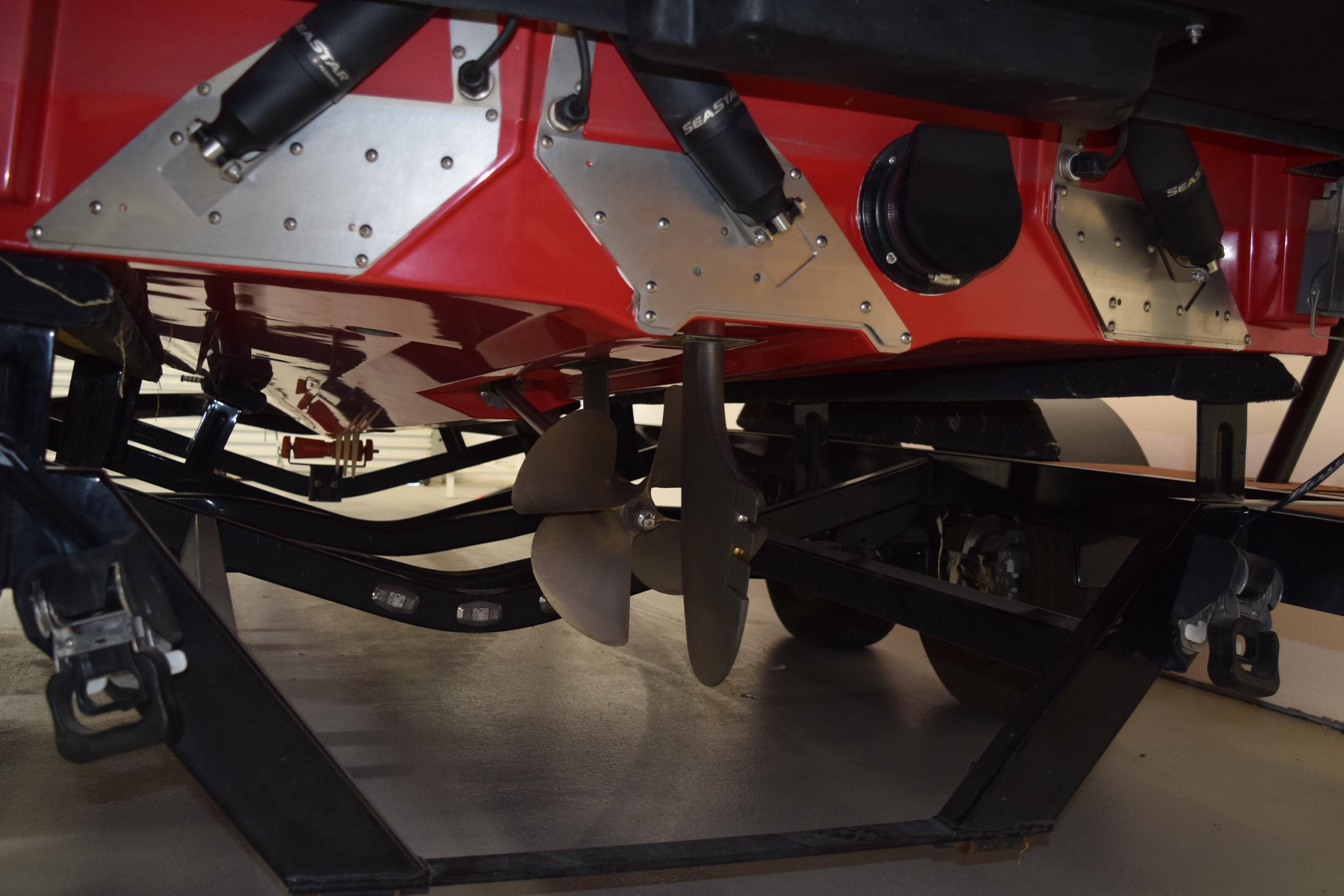 2024 Nautique Ski Nautique boat underside showing propeller and trailer components.