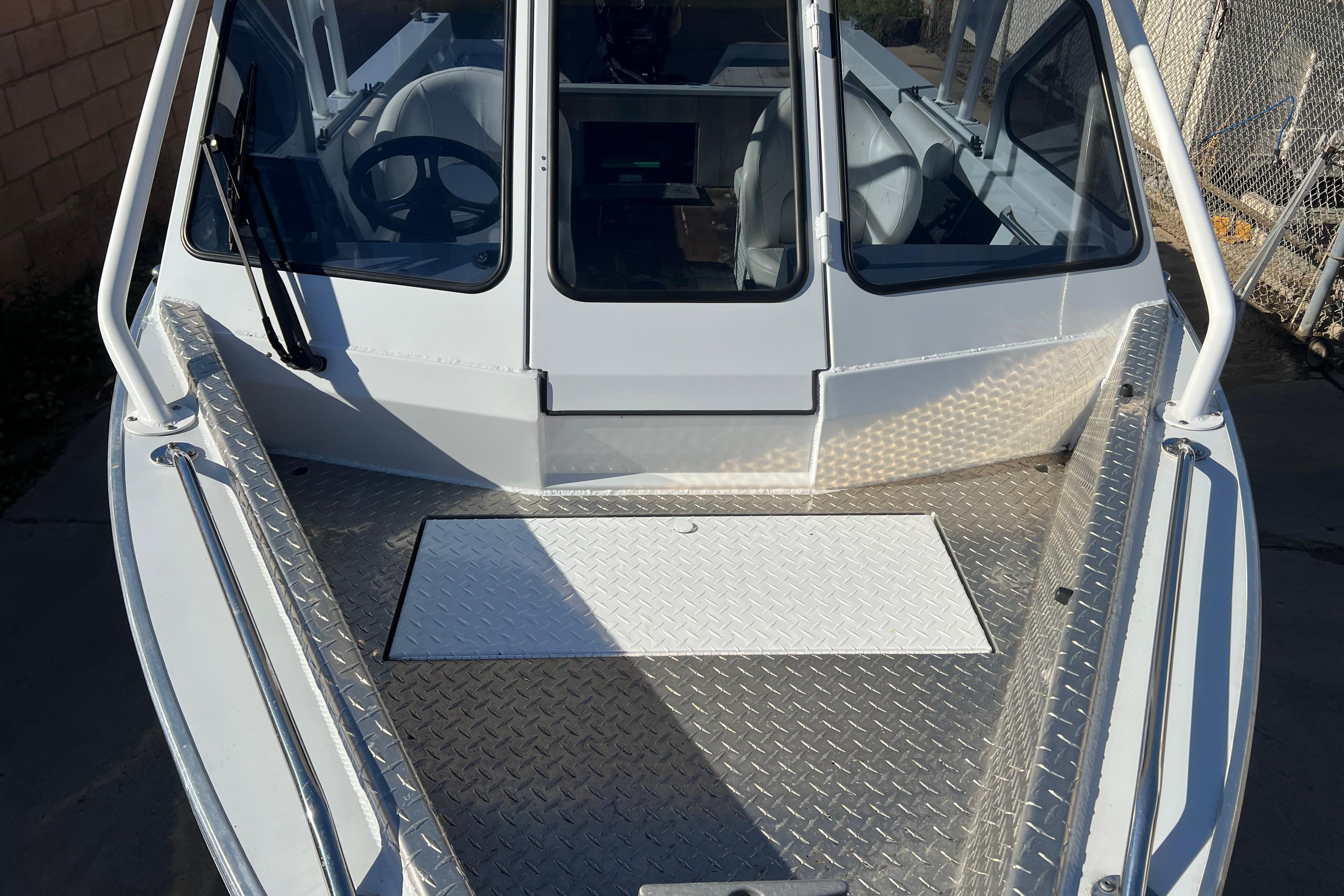 2019 KingFisher 1825 Falcon boat with aluminum deck and windshield.