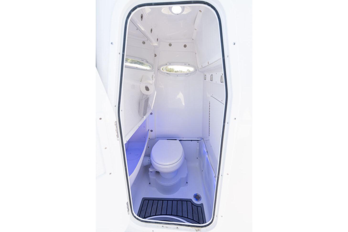 Manufacturer Provided Image: 2026 Sea Hunt Gamefish 27 Coffin Box boat interior with compact marine toilet.