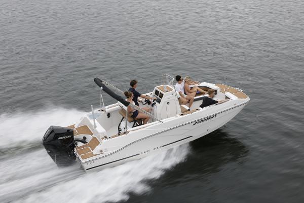 2025 Starcraft SVX 211 OB CC boat cruising on water with passengers.