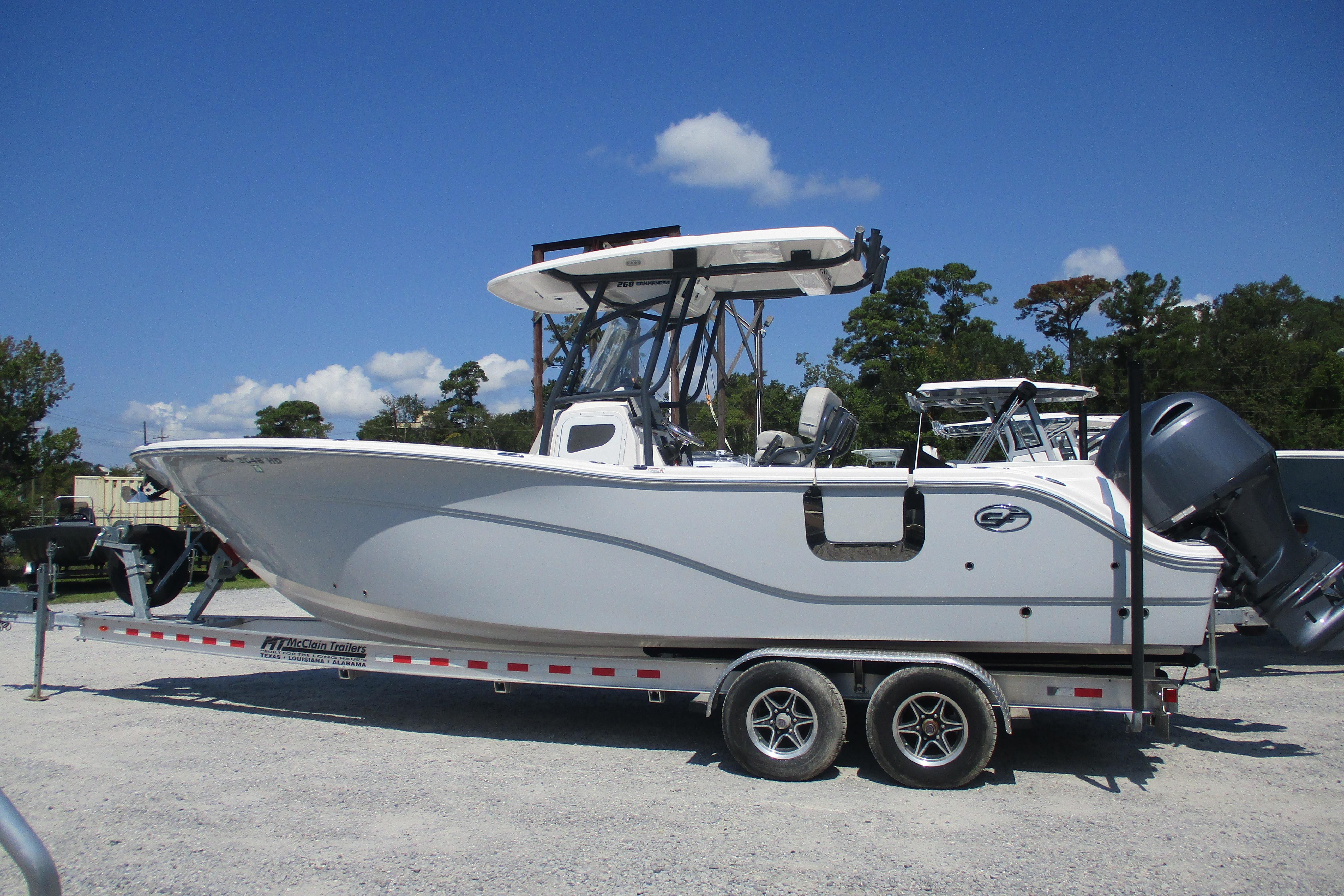 2024 Sea Fox 268 Commander boat on trailer under clear blue sky.