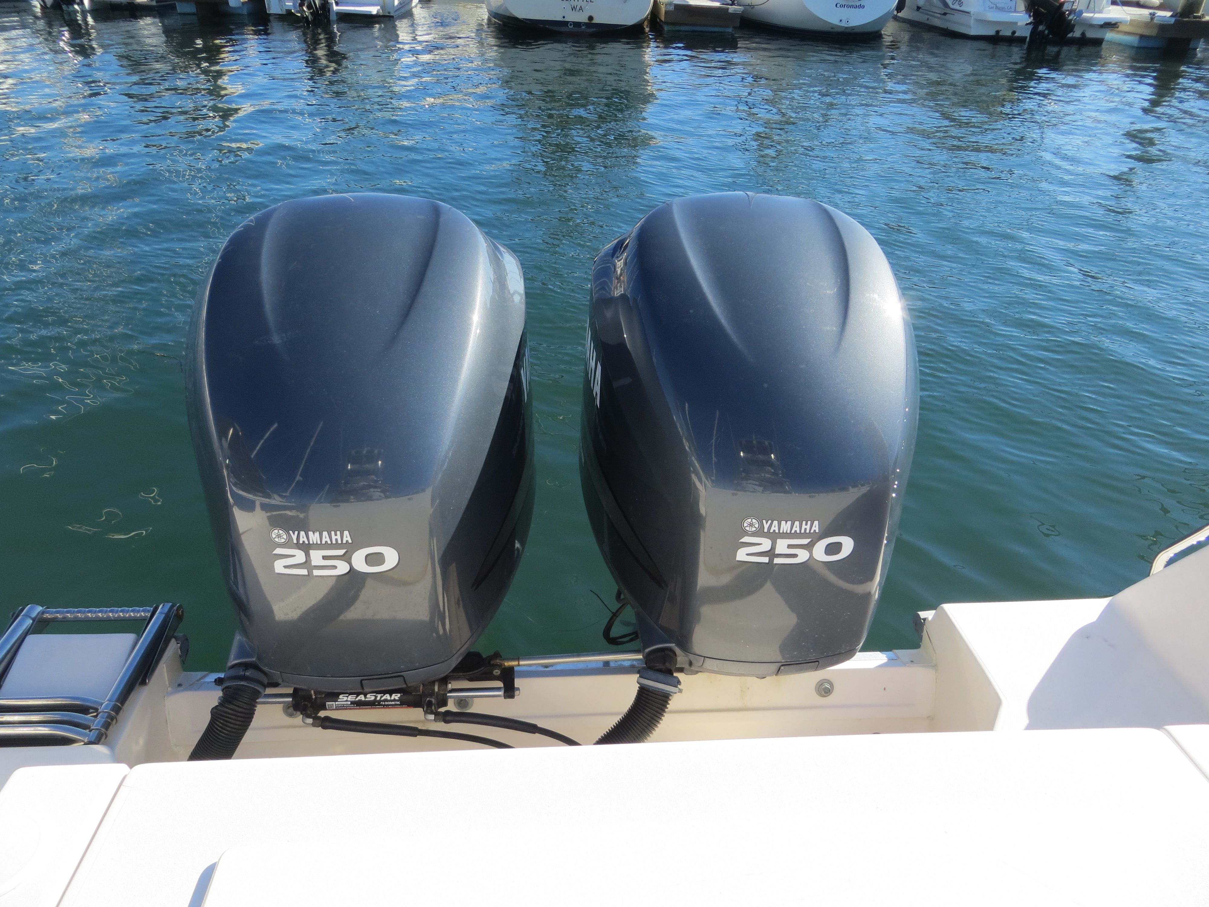 Two Yamaha 250 outboard engines on a Grady-White Sailfish 282 boat in the water.