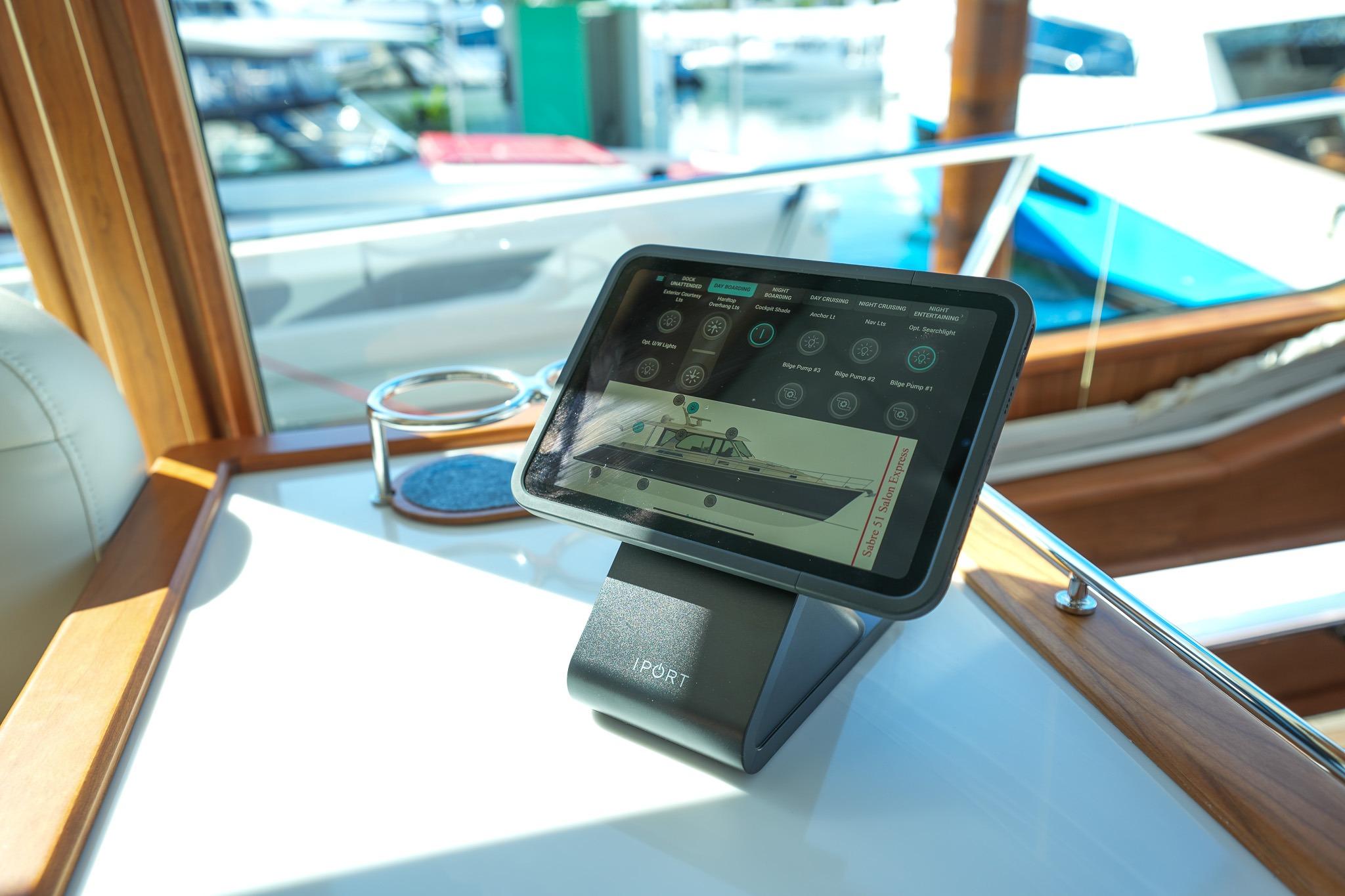 Tablet displaying controls on 2026 Sabre 51 Salon Express yacht dashboard.