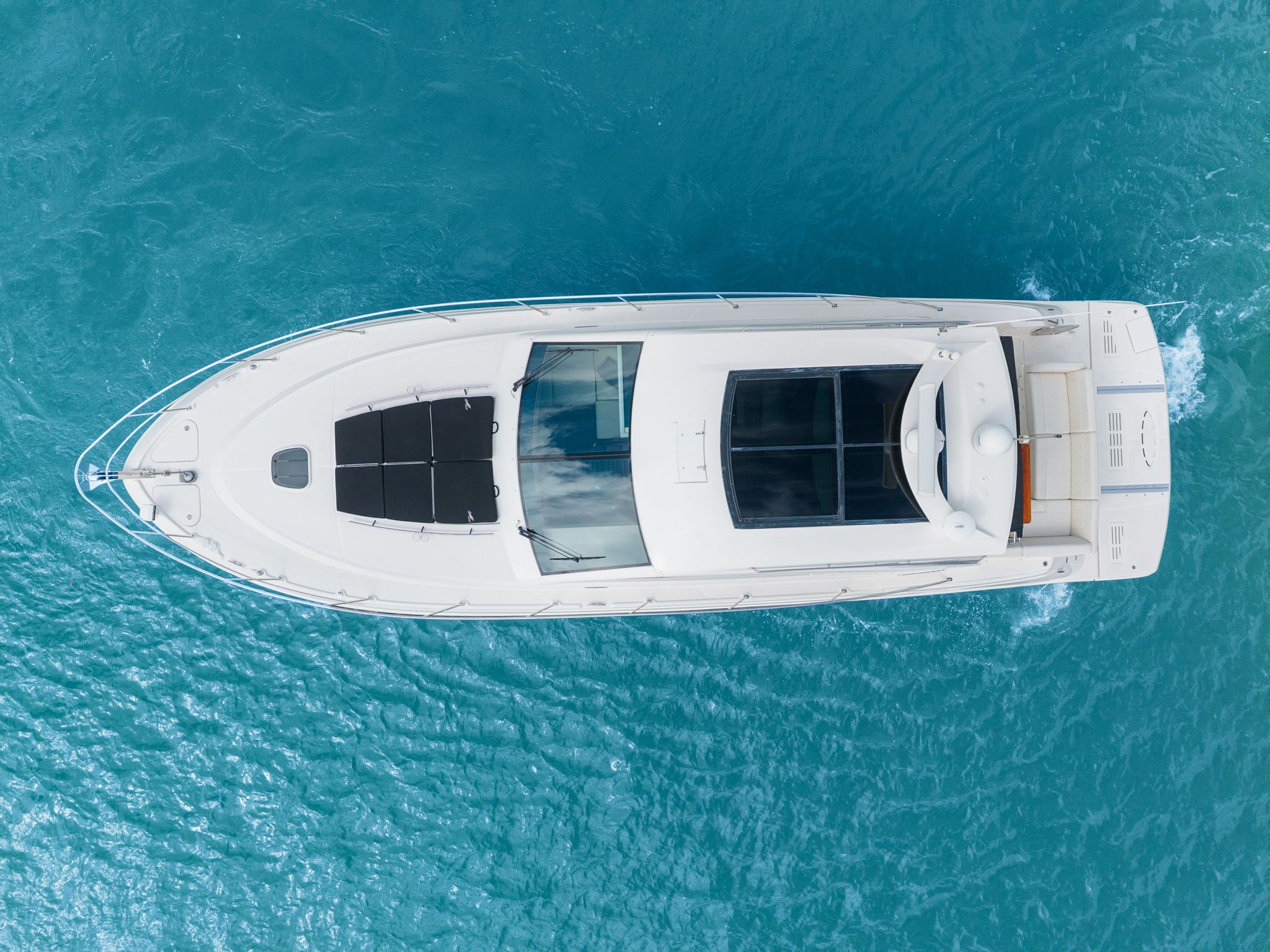 Aerial view of a 2017 Sea Ray Sundancer 510 on blue water.