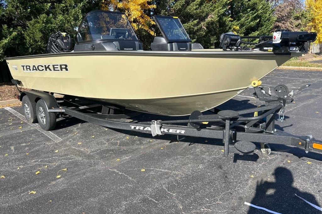 2026 Tracker Targa V-19 Combo boat on trailer in parking lot.