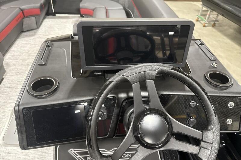 Steering console of 2026 Bennington 24 MFBSF boat with modern dashboard and seating.