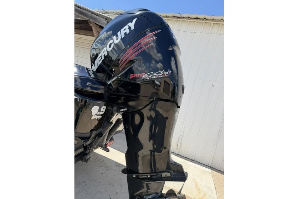 Mercury Pro XS outboard motor on 2016 Triton 216 Fishunter boat, side view.