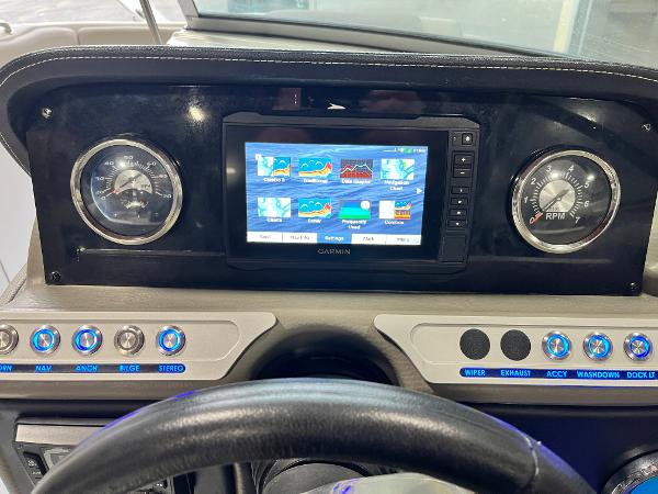 Dashboard of 2023 Crownline Eclipse E235 XS with Garmin display and gauges.