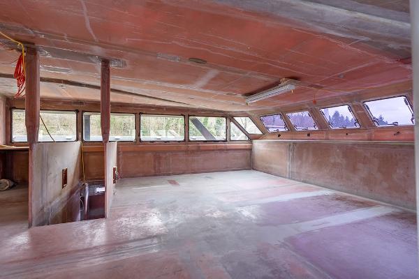 Interior of 2025 Catamaran Bloomfield 86 Motorsailor under construction, featuring spacious unfinished cabin.
