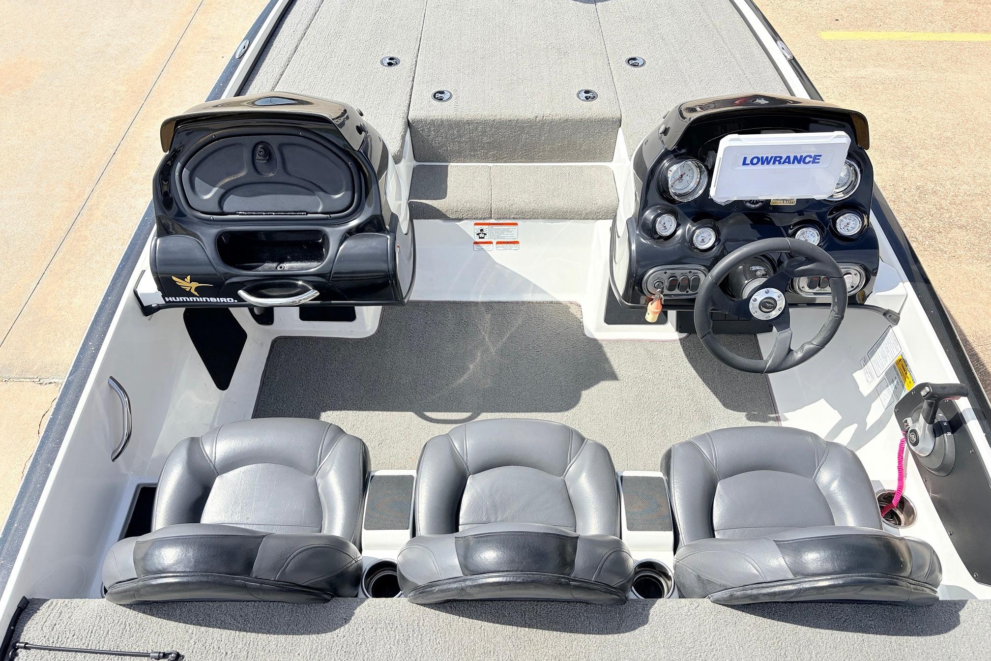 Interior of a 2011 Nitro Z-7 boat featuring steering console and seating.