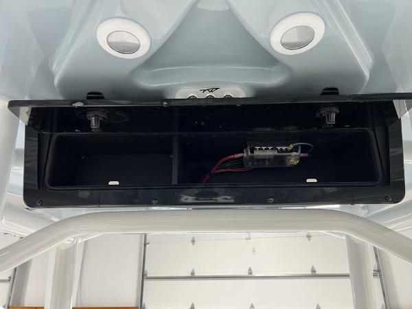 2025 Tidewater 2300 Carolina Bay boat console with open storage compartment.