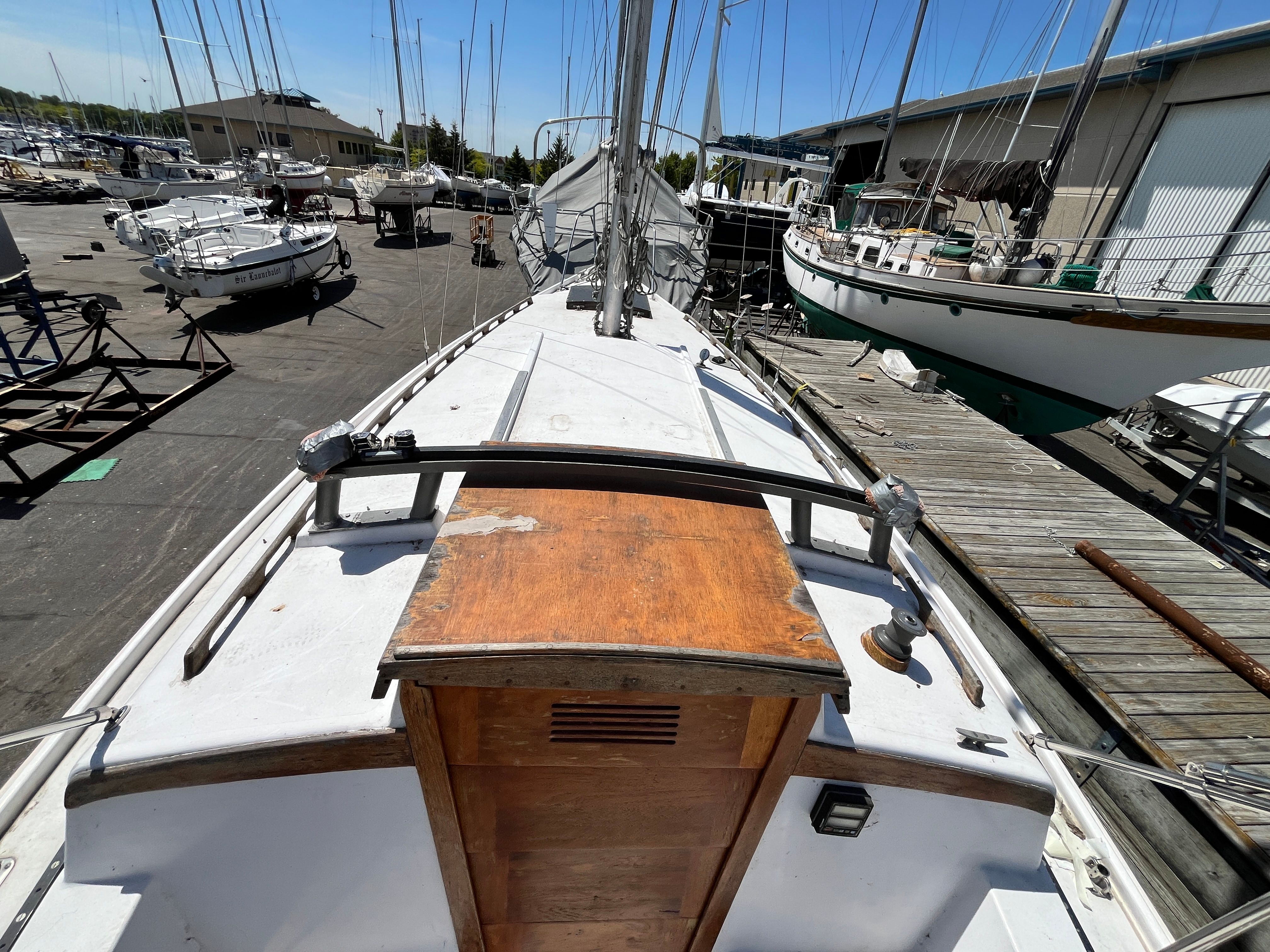 1974 Capital Newport 30 MKII sailboat docked in harbor.