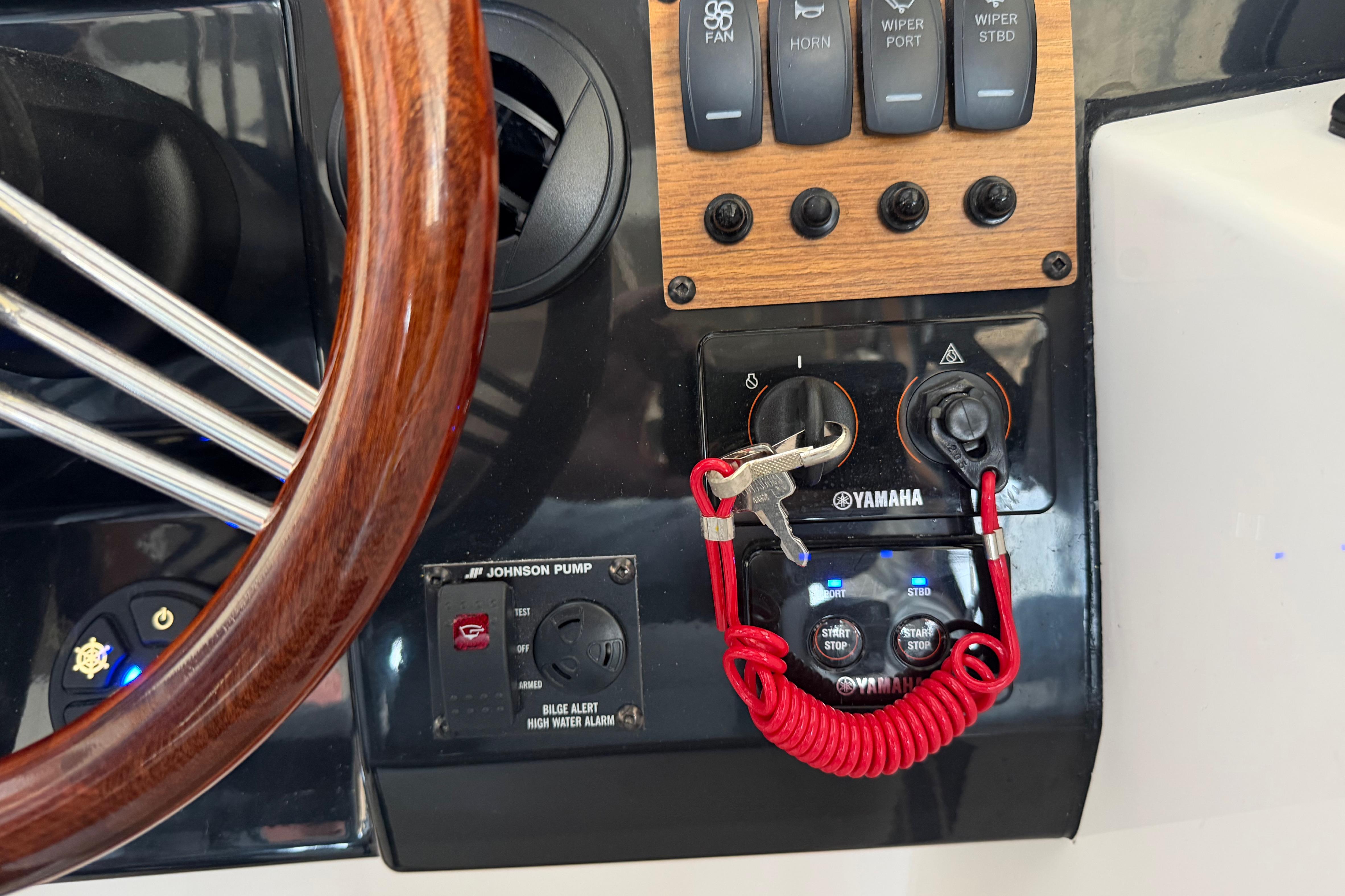 Control panel of 2023 Cutwater C-288 Coupe with Yamaha ignition and steering wheel.