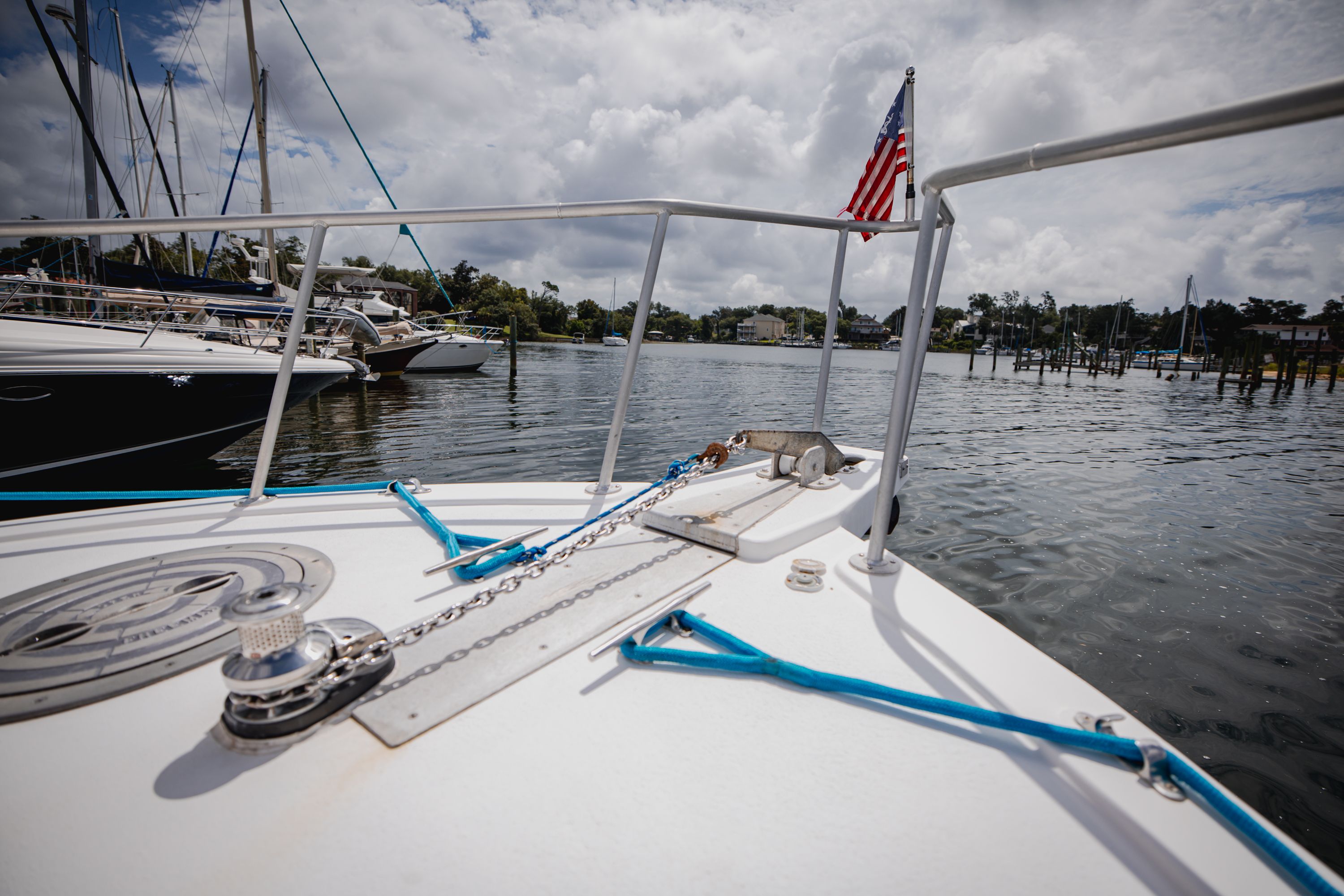 The boat is on the water, with an American flag at the stern.