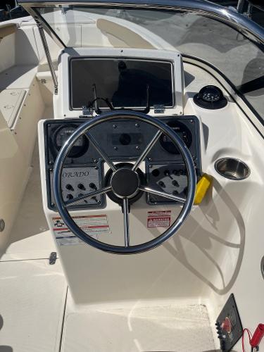 2018 Scout 210 Dorado boat dashboard with steering wheel and control panel.