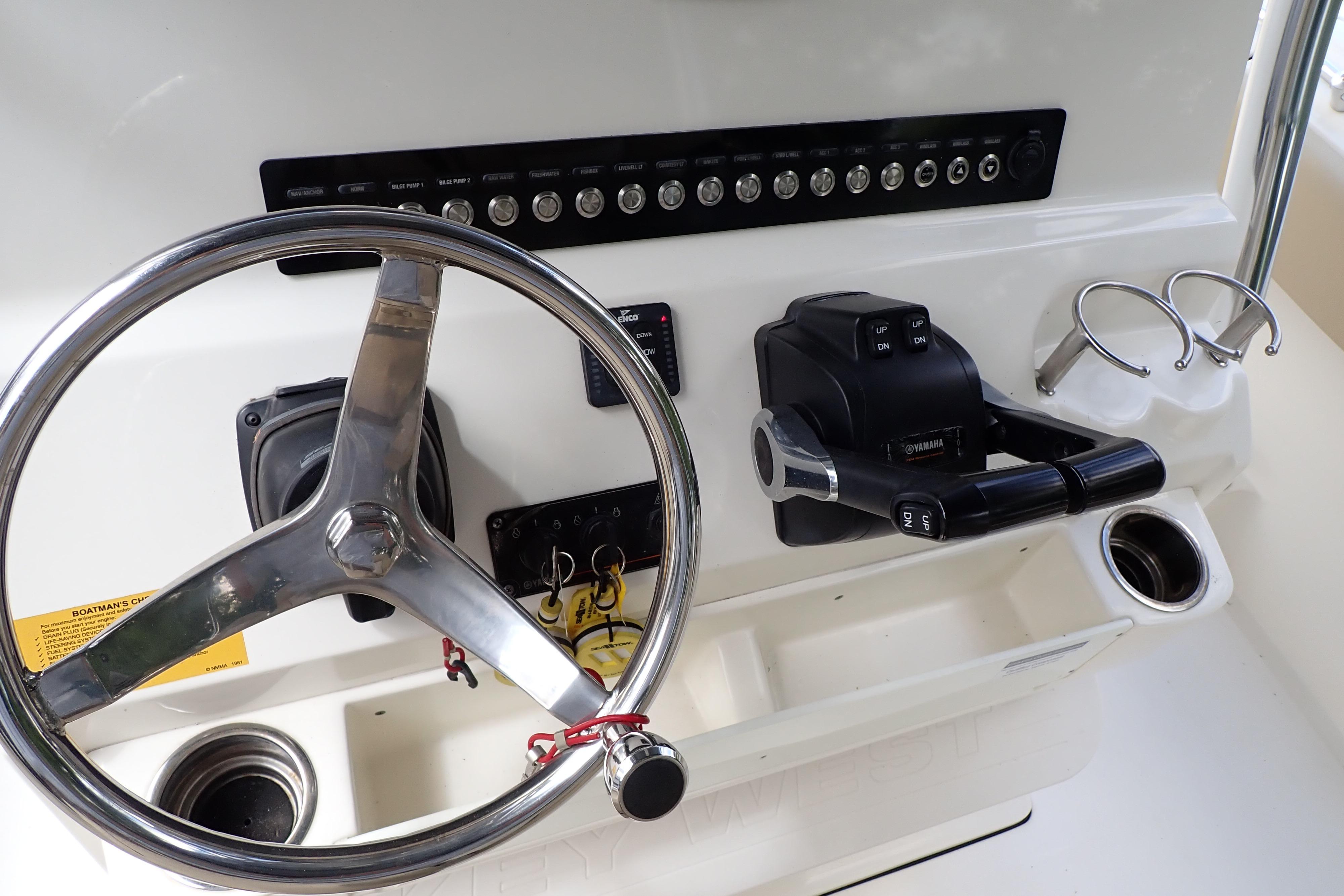 2019 Key West 263 FS boat dashboard with steering wheel and controls.