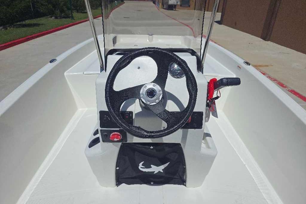 2026 Mako Pro Skiff 17 CC boat console with steering wheel and controls.