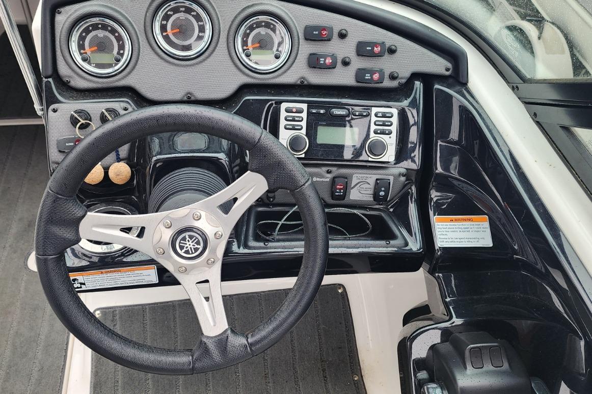 2015 Yamaha Boats 212X dashboard with steering wheel, gauges, and control panel.