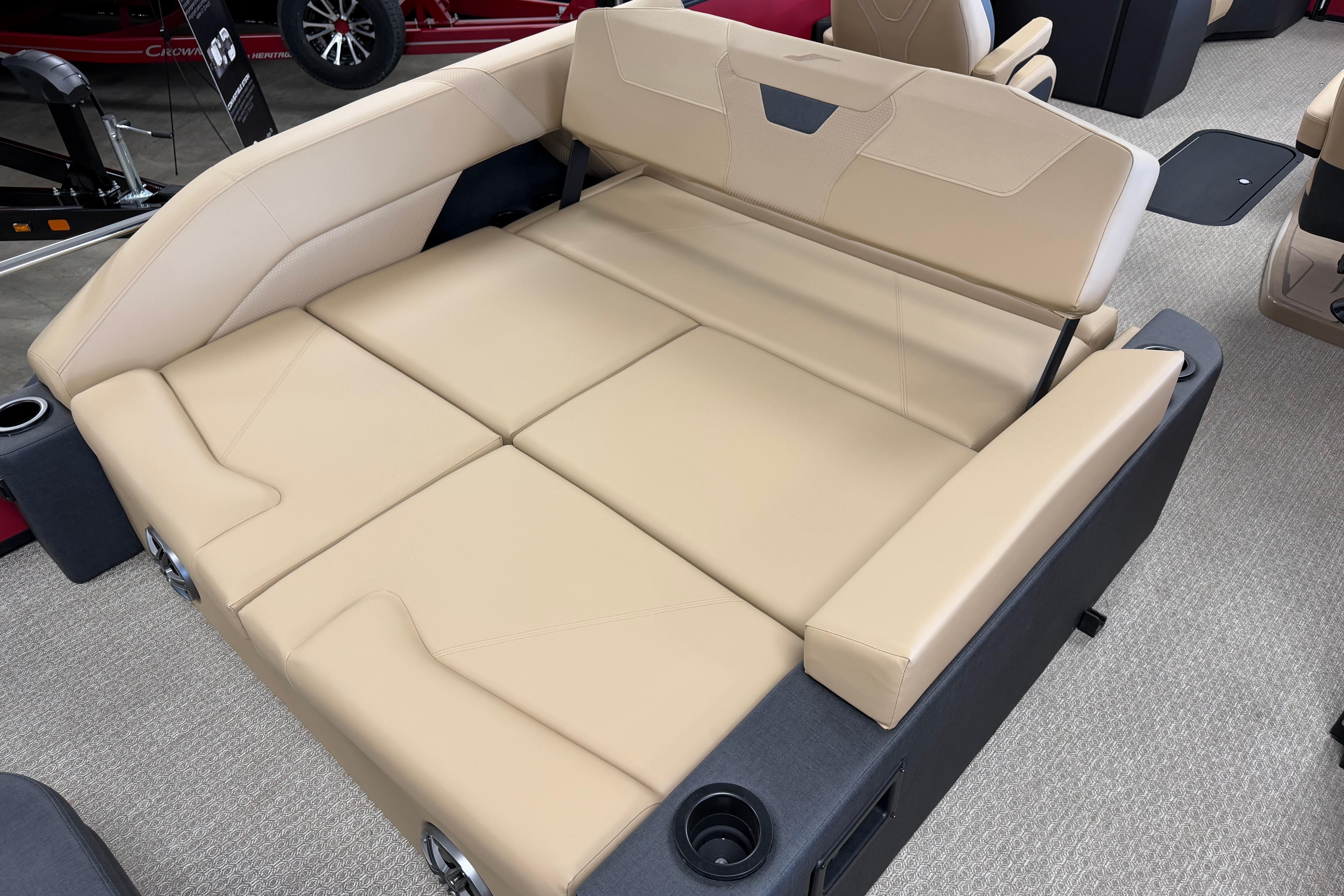 Luxurious beige seating in 2026 Evotti 523CS boat, featuring cup holders and modern design.