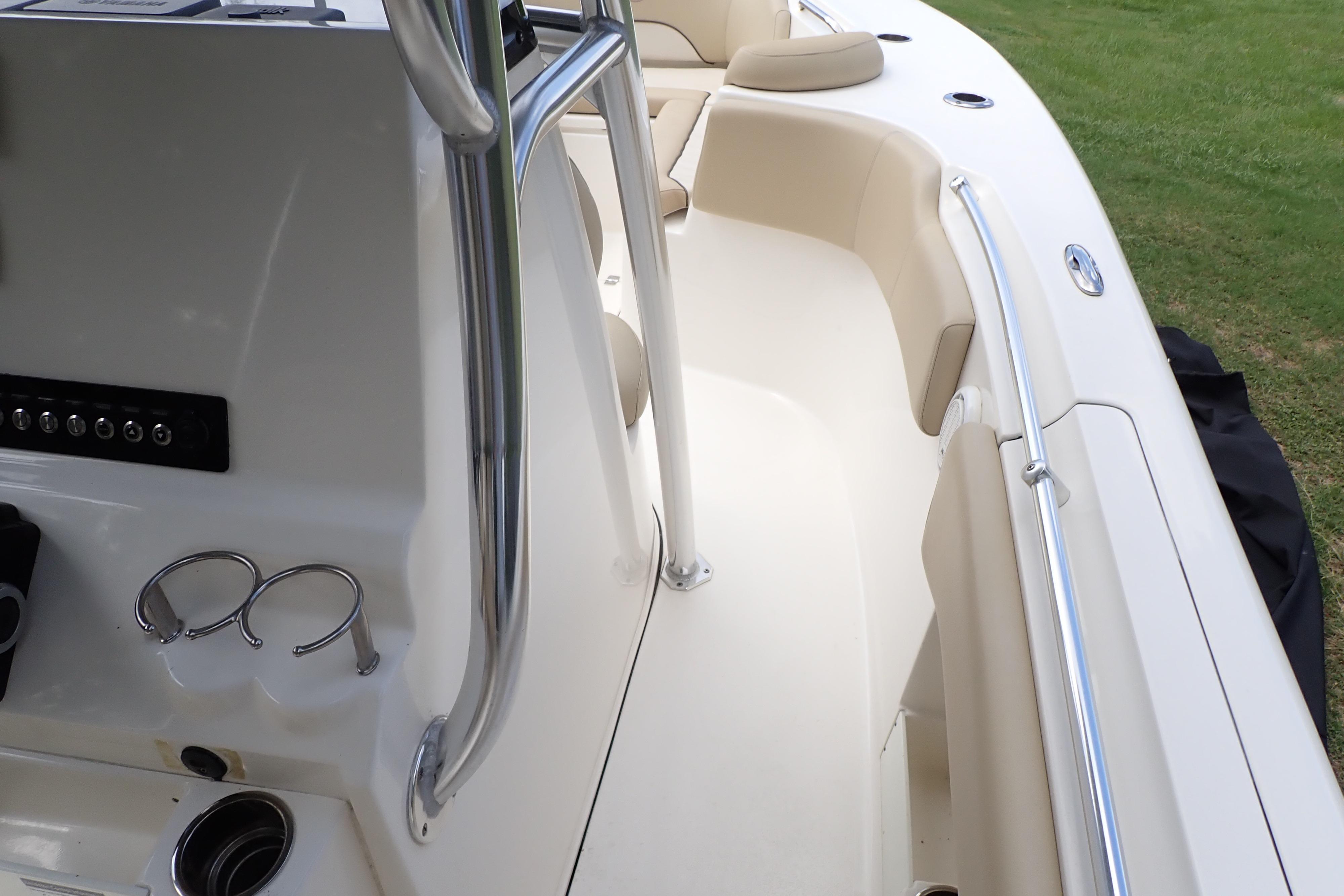2019 Key West 263 FS boat interior with seating and stainless steel railings.