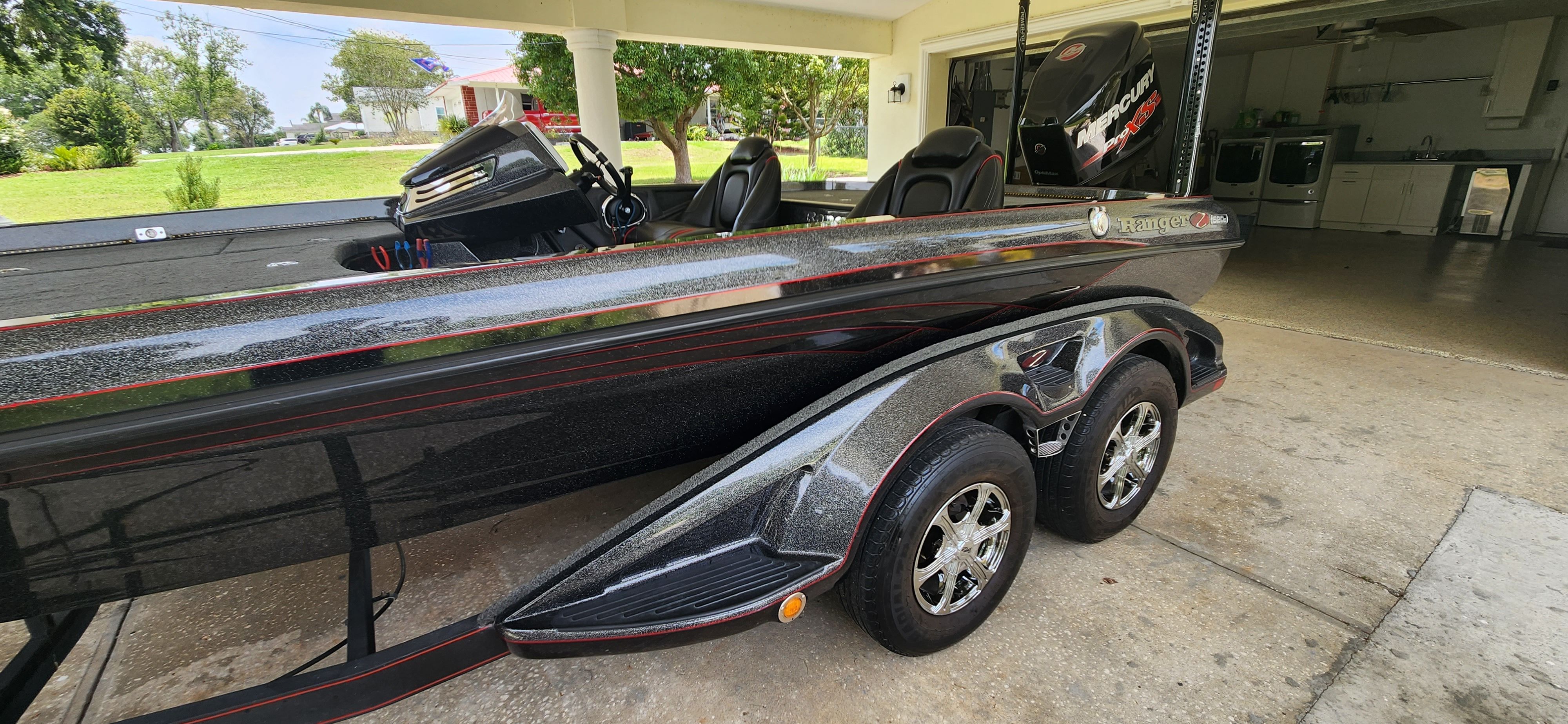 A 2017 Ranger Z520 Comanche bass boat on a trailer in a garage.