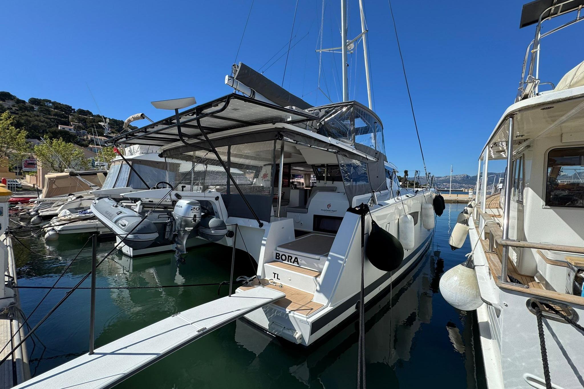 2025 Fountaine Pajot Tanna 47 catamaran docked in a sunny marina.